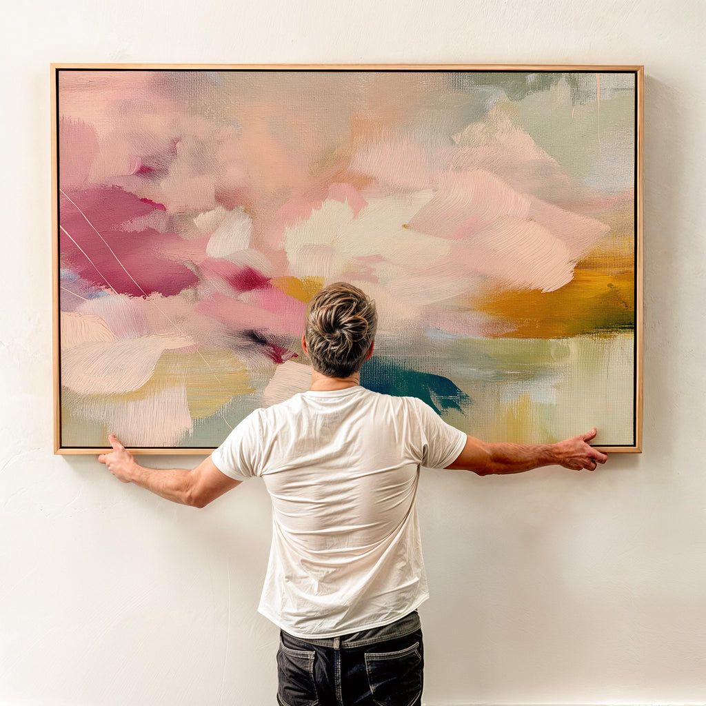 Soft blush, coral, teal and cream floral abstract framed canvas wall art by Muse Studio & Co. in a natural wood floating frame, styled as a calming focal piece in a warm contemporary living space.