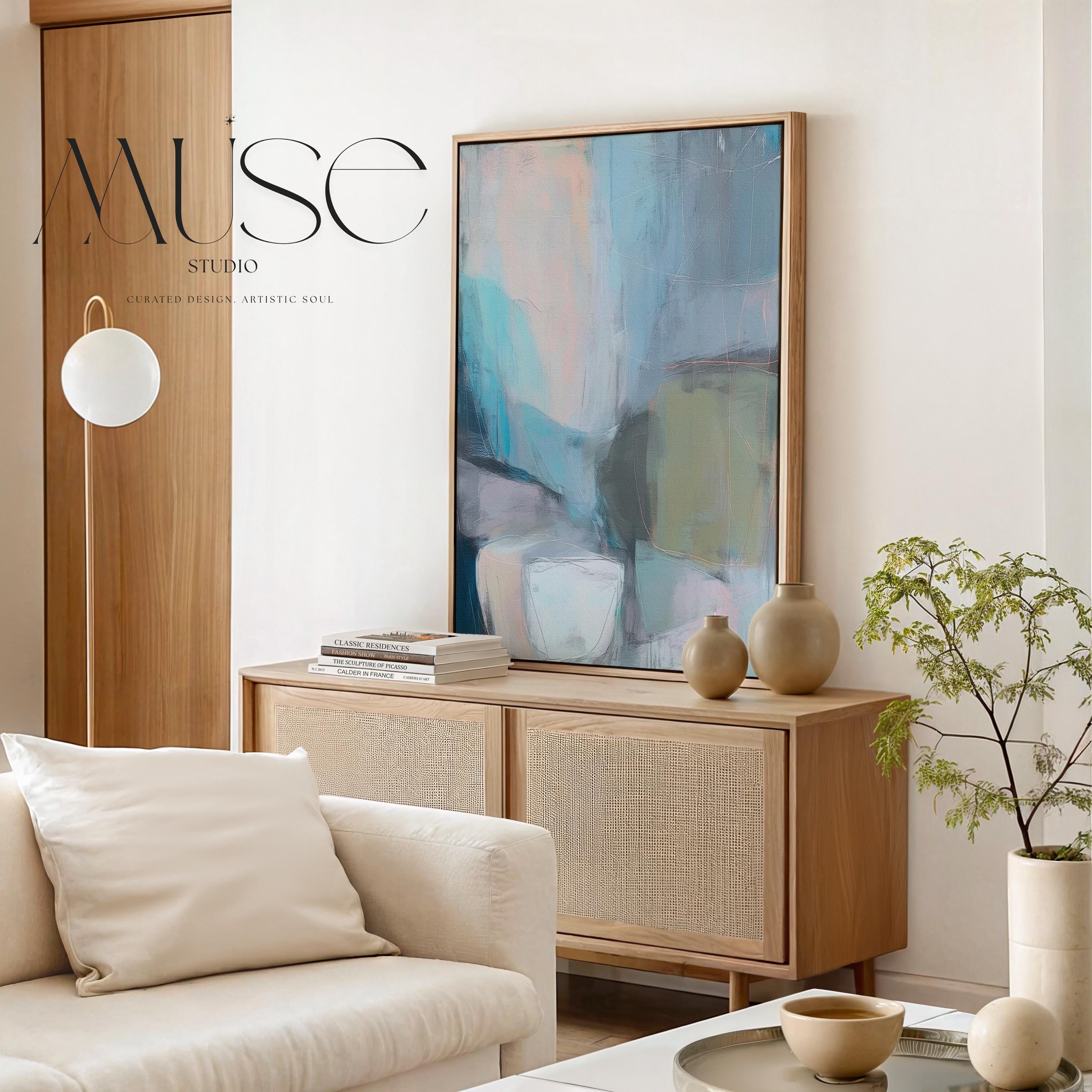 Muse Studio framed vertical abstract wall art in layered teal, blush, gray, and muted olive tones, printed with museum-grade giclée inks on premium gallery-wrapped canvas and finished in a natural wood floating frame for refined organic transitional interiors.