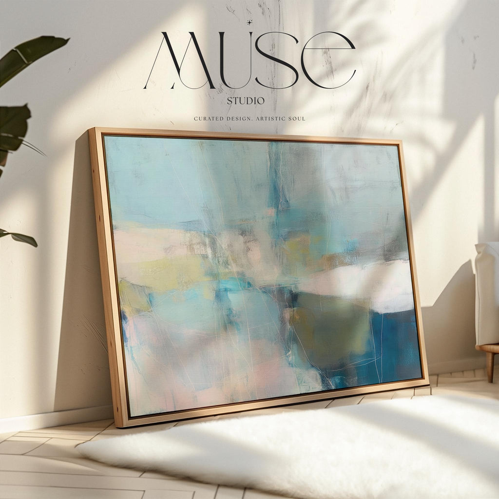Muse Studio framed horizontal coastal neutral abstract wall art in sea glass blue, blush, muted olive, and gray tones, printed with museum-grade giclée inks on premium gallery-wrapped canvas in a natural wood floating frame for beach house interiors.