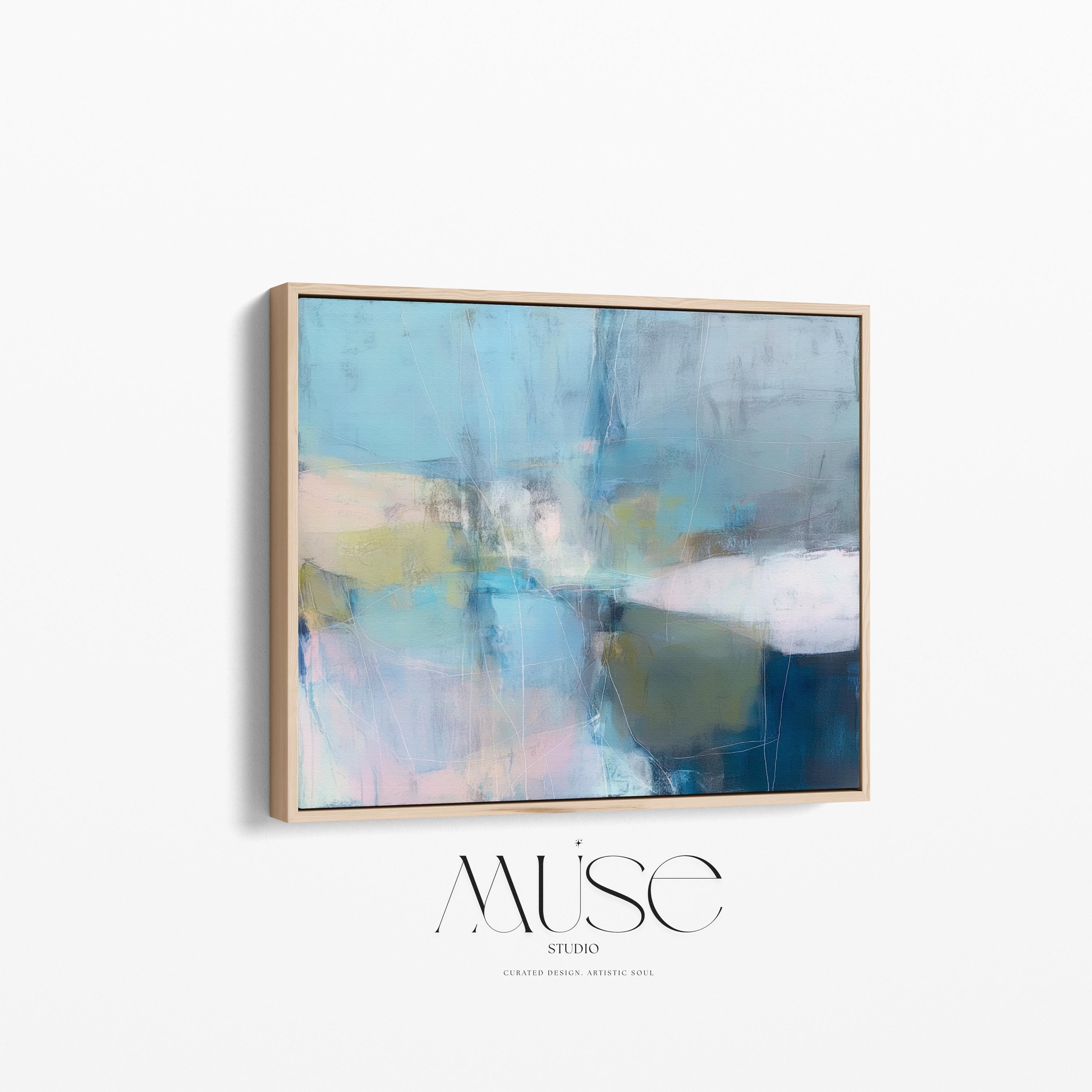 Muse Studio framed horizontal coastal neutral abstract wall art in sea glass blue, blush, muted olive, and gray tones, printed with museum-grade giclée inks on premium gallery-wrapped canvas in a natural wood floating frame for beach house interiors.