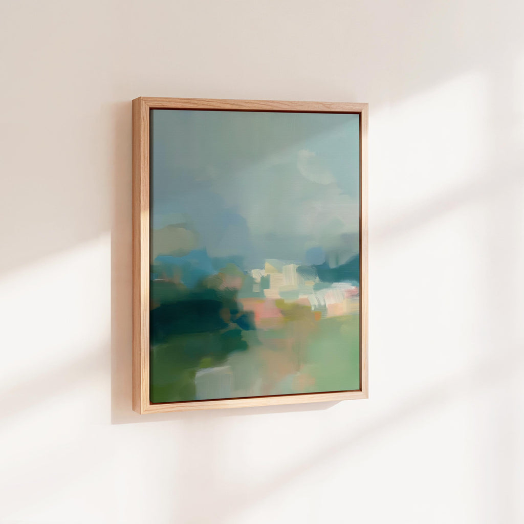 Misty Glade 1045 by Muse Studio vertical abstract landscape wall art inspired by misty woodland clearings, blending sage green, sea glass blue, soft cream, and pale peach light. Printed with museum-grade giclée inks on premium gallery-wrapped artist canvas and available framed in custom wood float frames for serene Organic Transitional interiors.