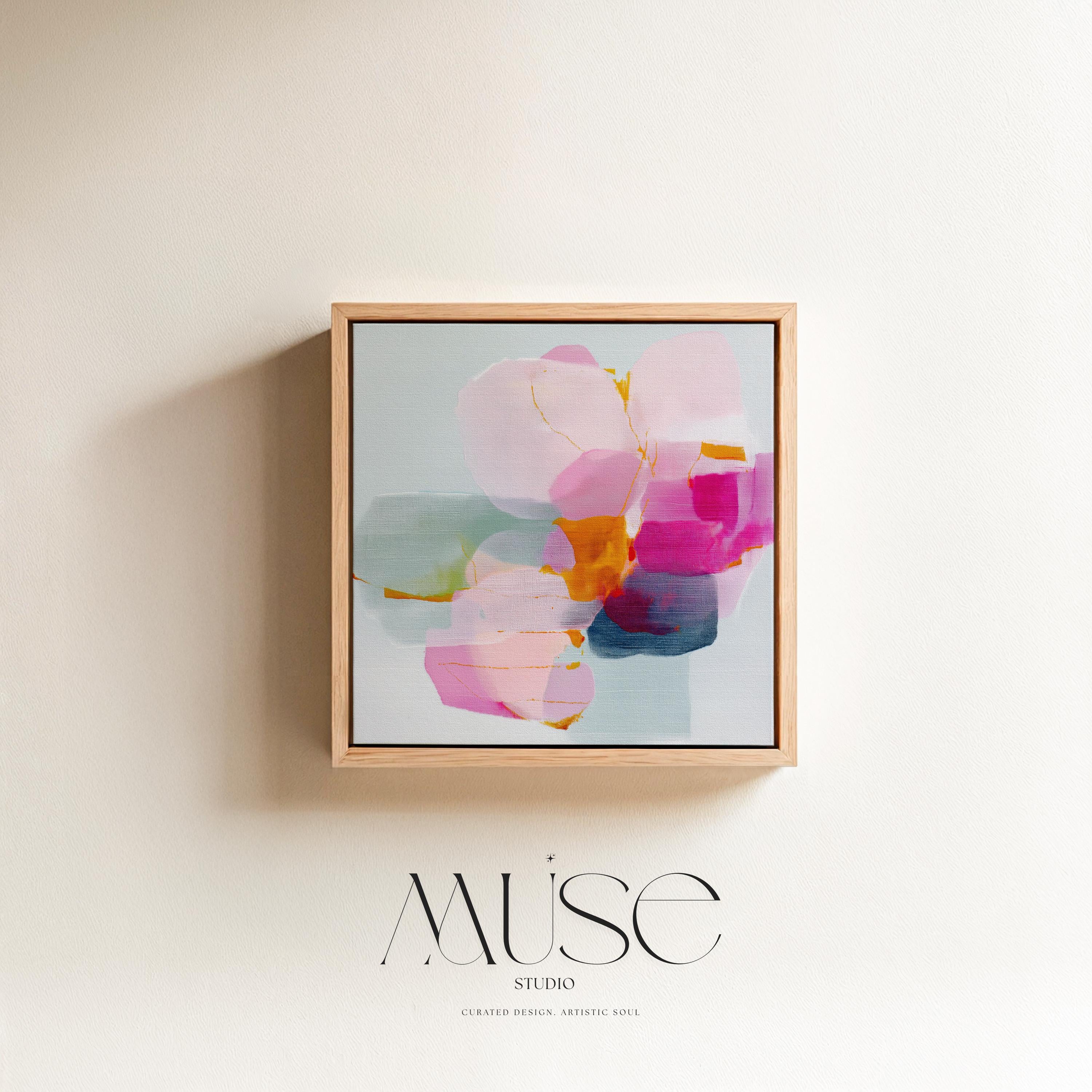 First Bloom 1052 by Muse Studio large framed floral wall art featuring blush pink, magenta, soft blue, and golden ochre painterly blooms printed with museum-grade giclée inks on premium gallery-wrapped canvas, framed in natural wood for Romantic Botanical bedrooms and serene designer interiors.