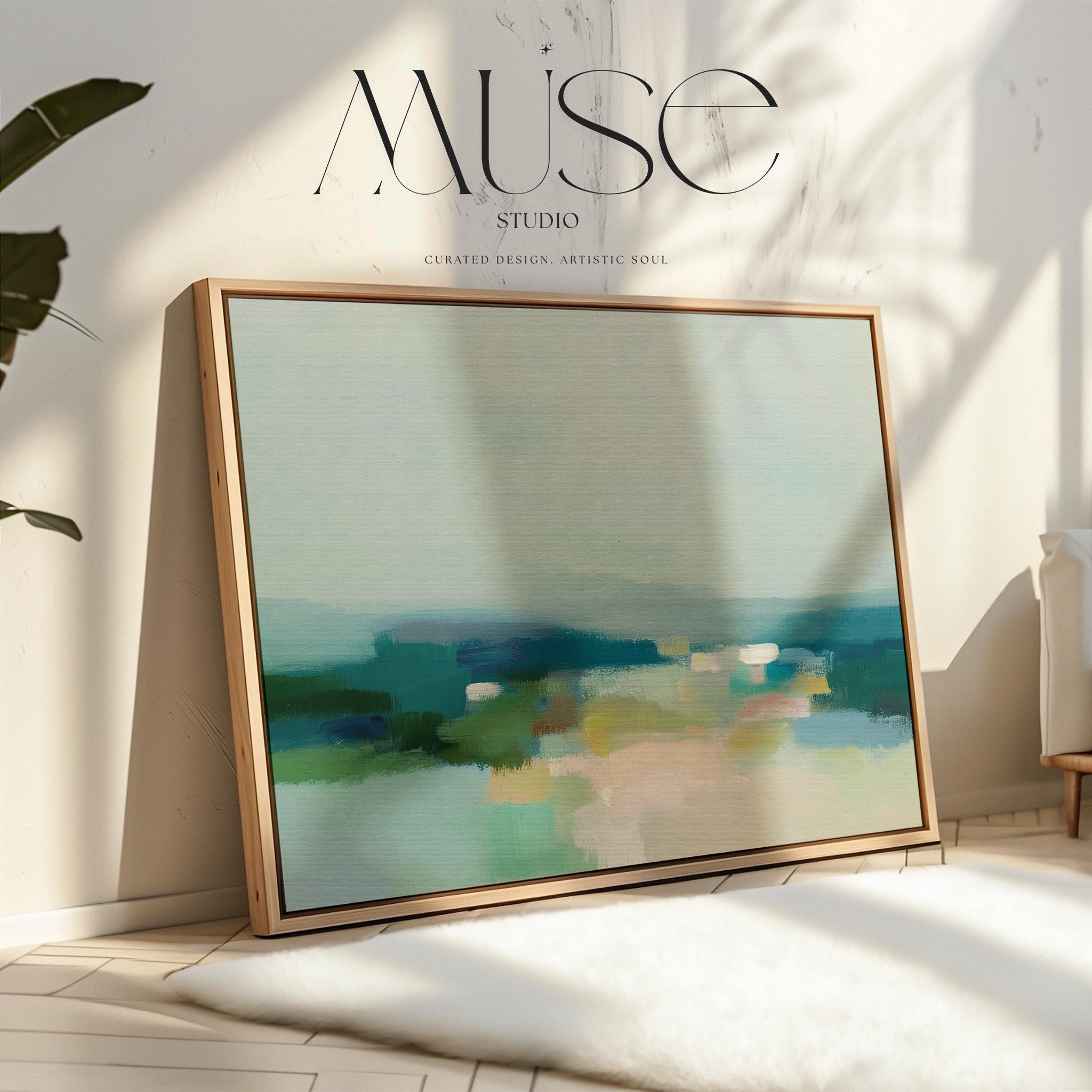 Muse Studio large framed canvas wall art in a coastal neutral abstract composition featuring soft teal, sage, and sand tones with layered horizon movement, printed with museum-grade giclée inks on premium artist canvas and framed in natural wood for living room styling.
