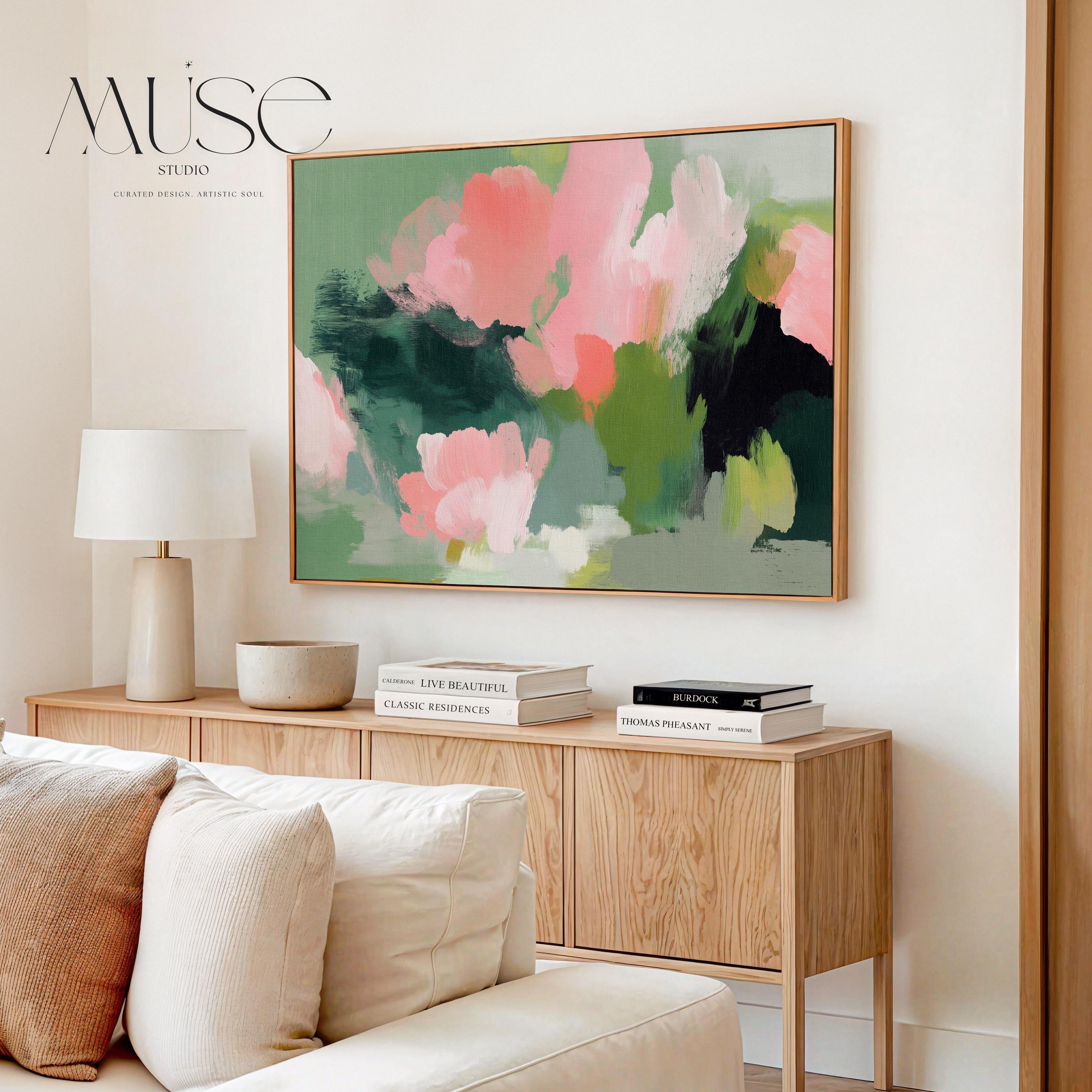 Coral Bloom No. 1040 by Muse Studio & Co. coral pink floral wall art with blush and sage abstract botanical brushwork printed with museum-grade giclée inks on premium gallery-wrapped cotton canvas and custom framed in natural, white, black, antique gold, or antique silver float frames to complement any decor style, styled in a coastal tropical beach home living room with light wood floors and airy interiors.