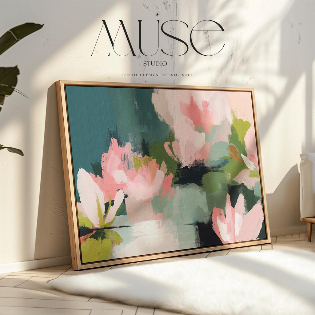 Magnolia Reverie No. 1037 by Muse Studio & Co. blush pink magnolia floral wall art with sage green and deep teal botanical brushwork printed with museum-grade giclée inks on premium gallery-wrapped cotton canvas and custom framed in natural wood with optional white, black, antique gold, or antique silver float frames to complement any decor style, styled in a coastal tropical beach home living room with airy interiors and light wood floors.