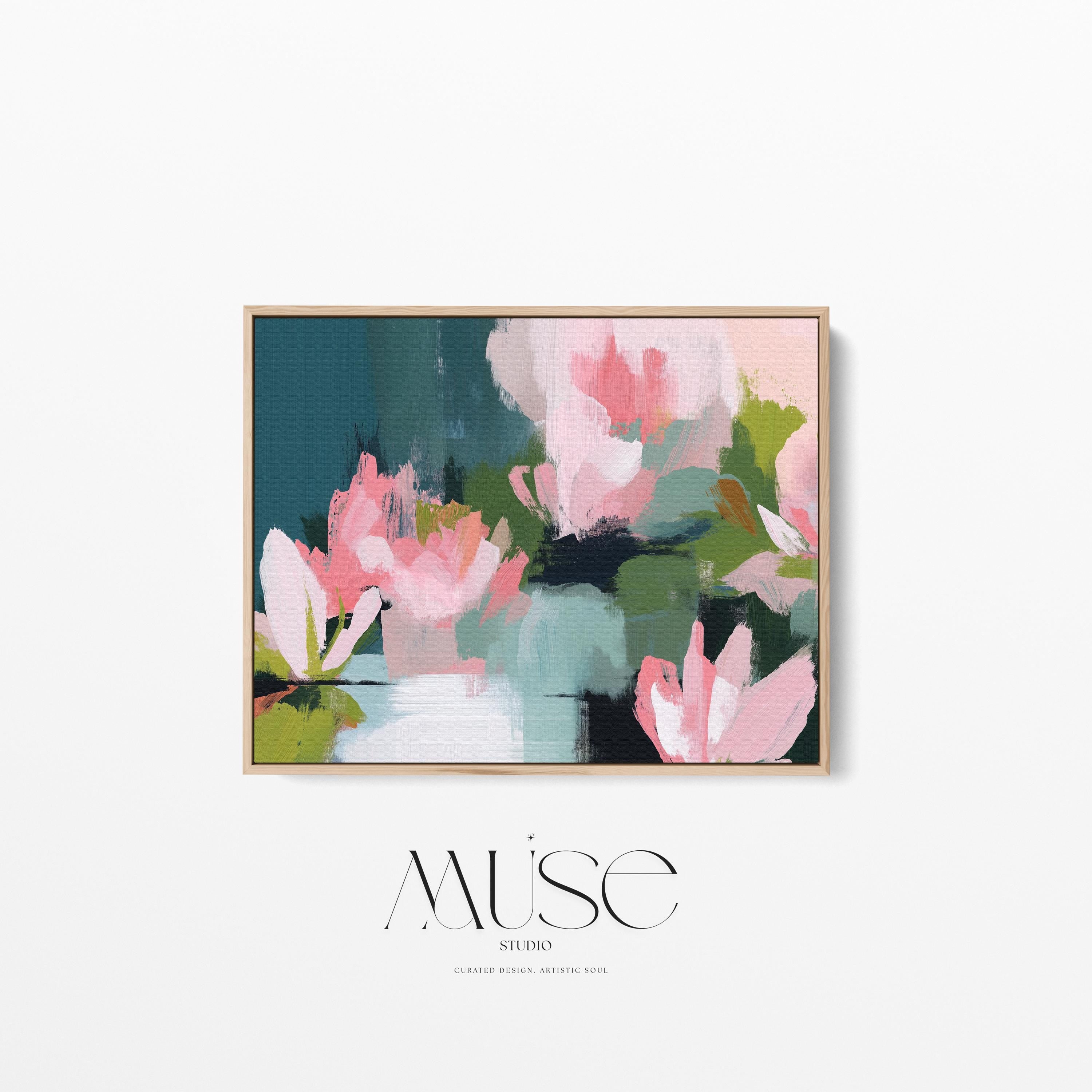 Magnolia Reverie No. 1037 by Muse Studio & Co. blush pink magnolia floral wall art with sage green and deep teal botanical brushwork printed with museum-grade giclée inks on premium gallery-wrapped cotton canvas and custom framed in natural wood with optional white, black, antique gold, or antique silver float frames to complement any decor style, styled in a coastal tropical beach home living room with airy interiors and light wood floors.