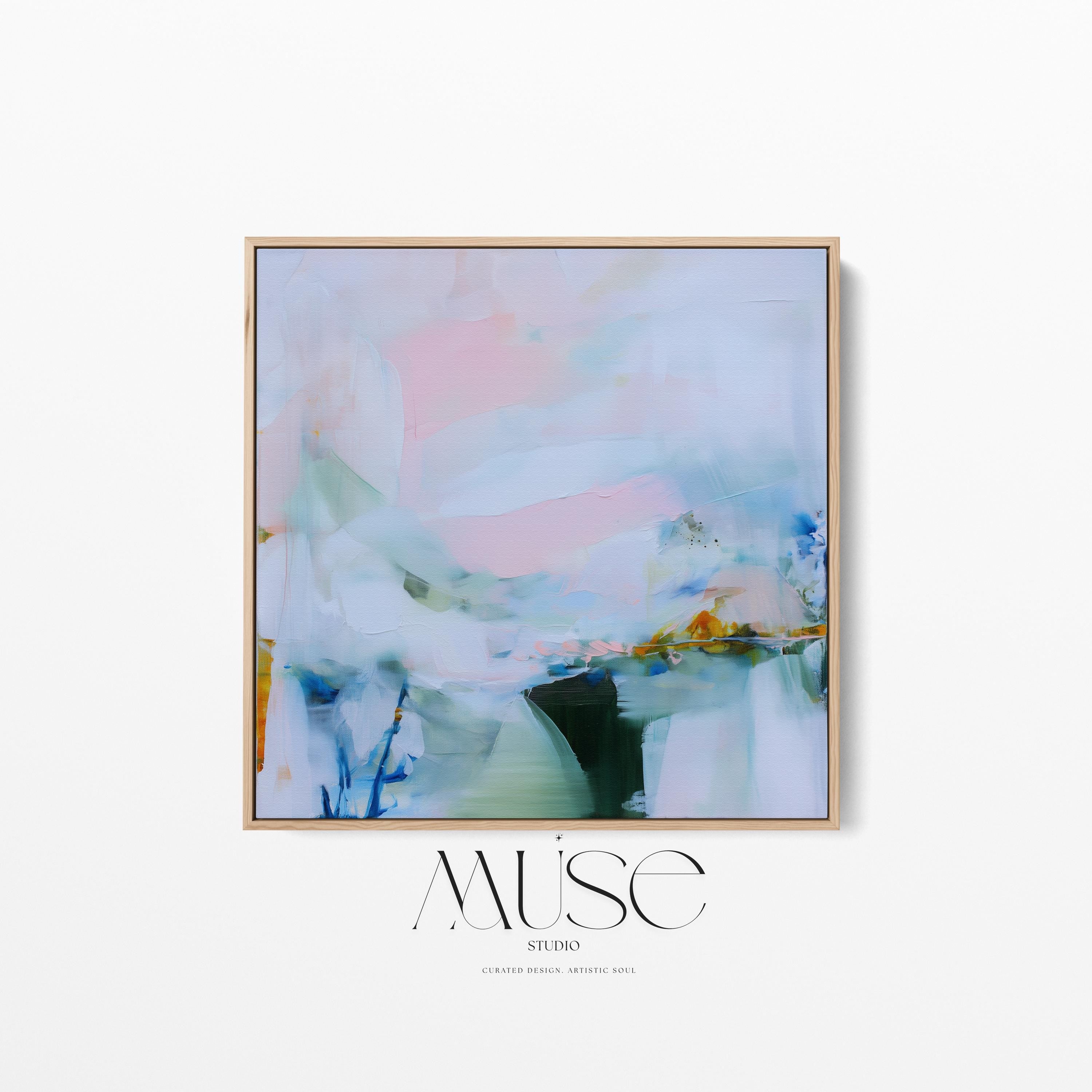 Muse Studio framed abstract wall art in soft blush, misted blue, pale sage, and deep teal with warm ochre accents, printed with museum-grade giclée inks on premium gallery-wrapped canvas, set in a natural wood float frame, styled above a neutral linen sofa in an organic transitional living room with warm oak tones and layered textures.