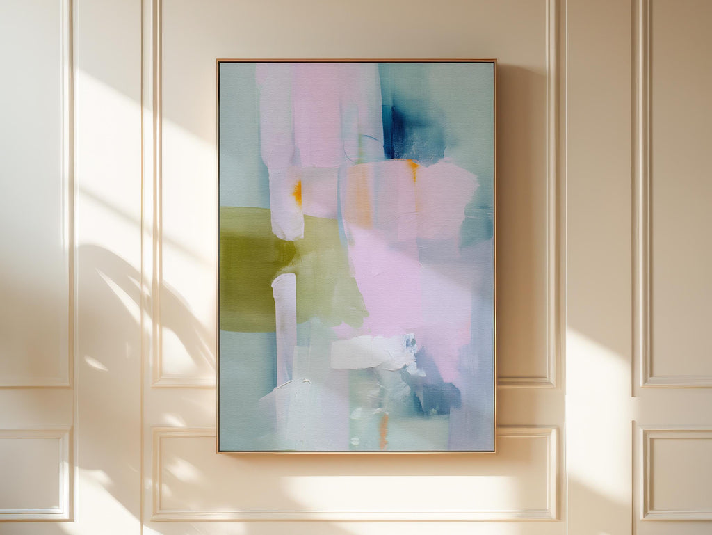 Muse Studio framed abstract wall art titled Soft Sonata 1043 in blush, sage, lilac, and misted blue, printed with museum-grade giclée inks on premium gallery-wrapped canvas in a natural wood float frame, styled vertically in a serene organic transitional bedroom and spa-inspired bathroom with warm oak and soft neutral textiles.