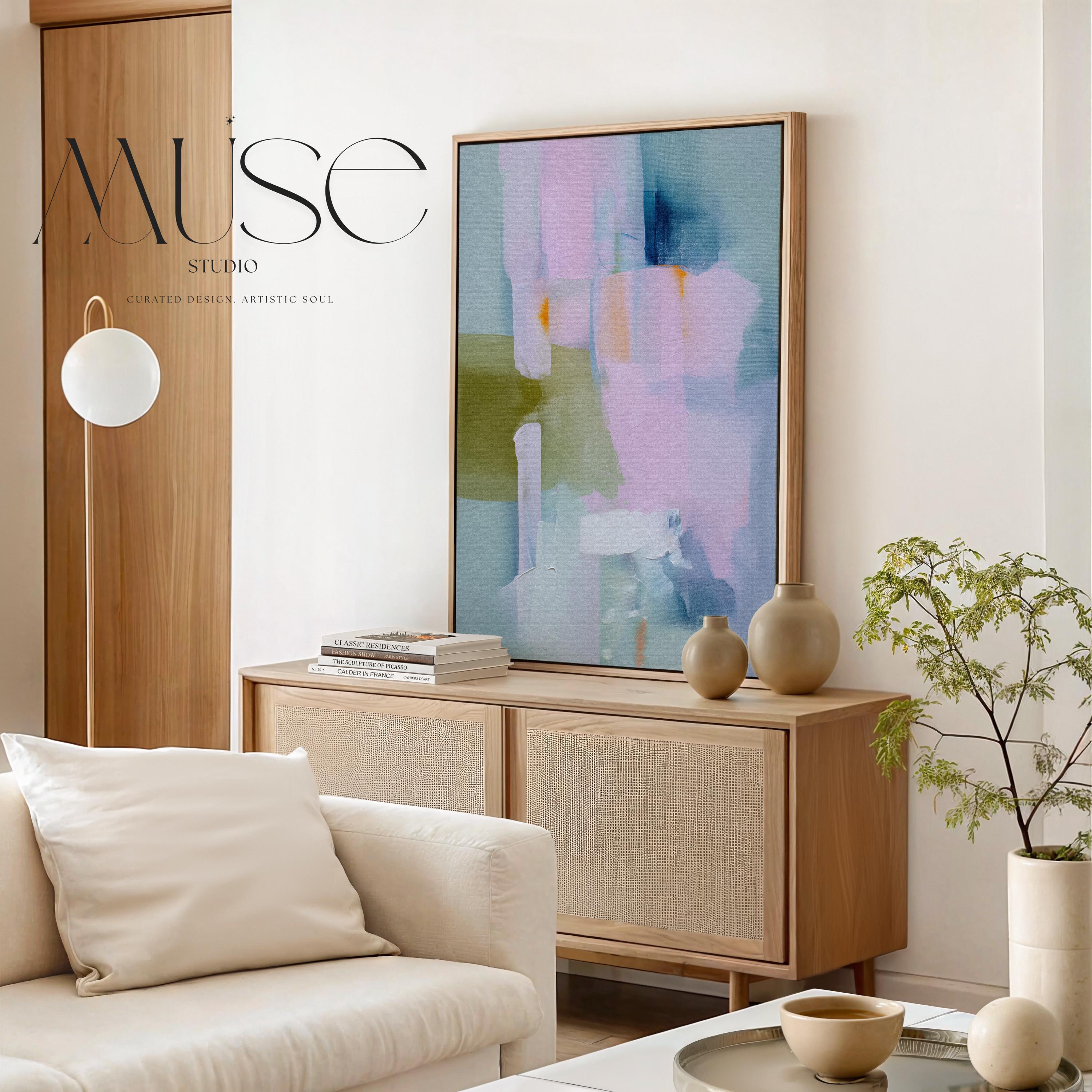 Muse Studio framed abstract wall art titled Soft Sonata 1043 in blush, sage, lilac, and misted blue, printed with museum-grade giclée inks on premium gallery-wrapped canvas in a natural wood float frame, styled vertically in a serene organic transitional bedroom and spa-inspired bathroom with warm oak and soft neutral textiles.