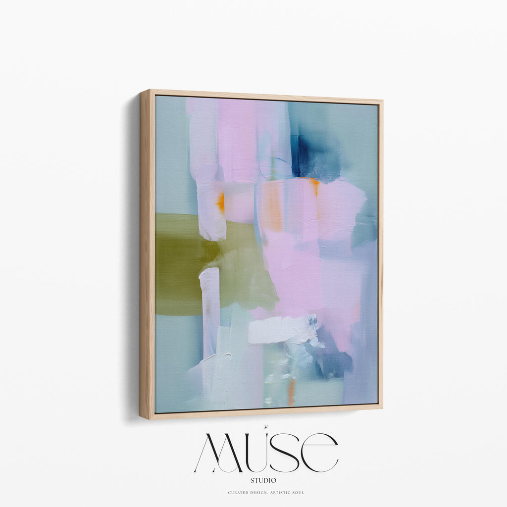 Muse Studio framed abstract wall art titled Soft Sonata 1043 in blush, sage, lilac, and misted blue, printed with museum-grade giclée inks on premium gallery-wrapped canvas in a natural wood float frame, styled vertically in a serene organic transitional bedroom and spa-inspired bathroom with warm oak and soft neutral textiles.