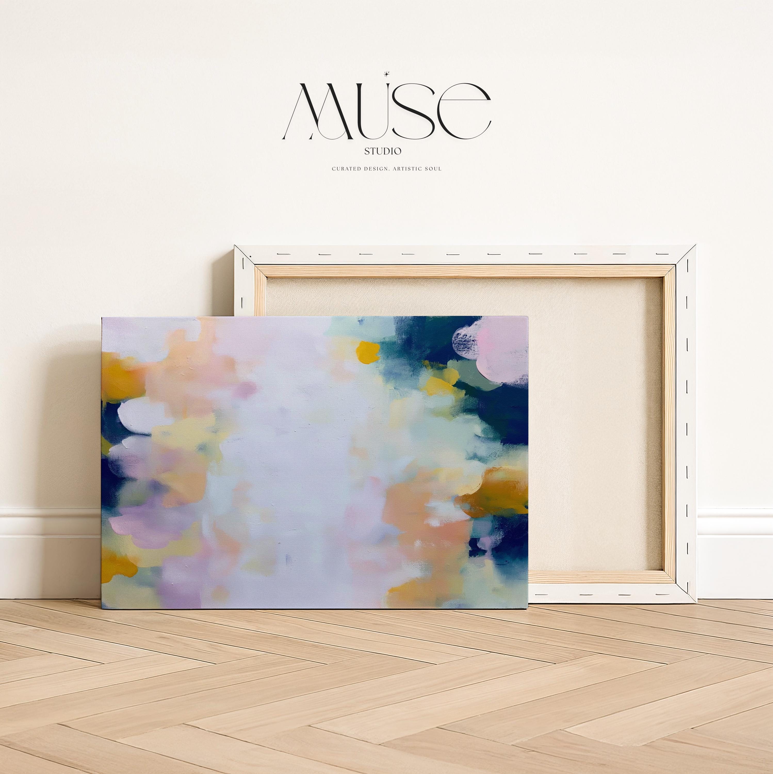 Muse Studio large horizontal abstract canvas wall art printed with museum-grade giclée inks on premium gallery-wrapped canvas, featuring blush and navy pastel tones in an Organic Transitional style, styled above a bed in a serene coastal bedroom.