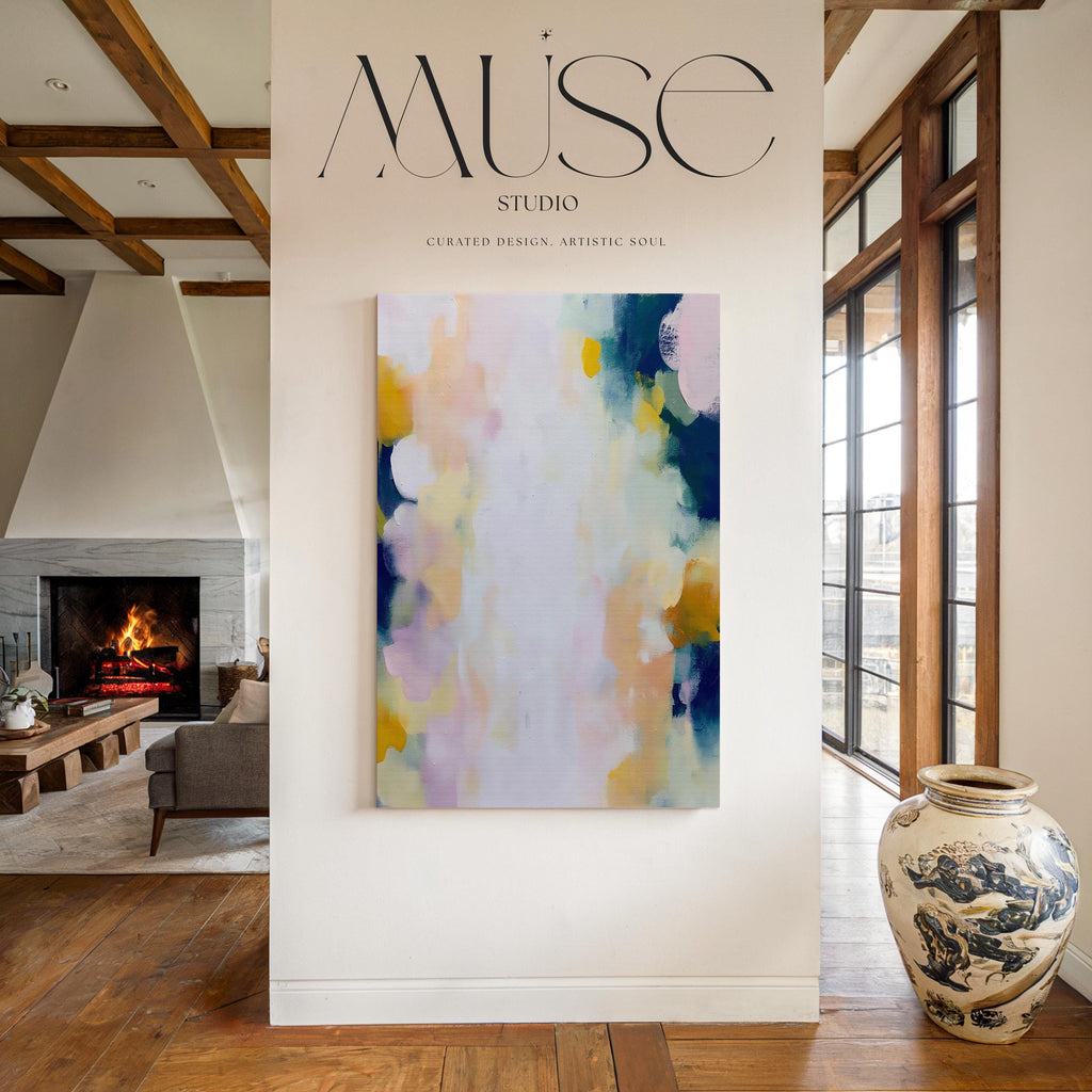 Muse Studio large vertical abstract canvas wall art printed with museum-grade giclée inks on premium gallery-wrapped canvas, featuring blush and navy pastel tones in an Organic Transitional style, styled above a dresser in a serene coastal bedroom.