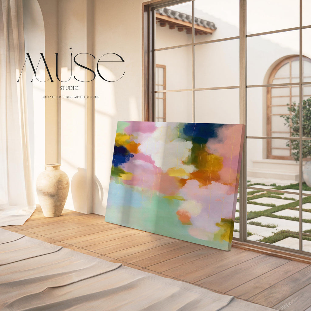 Muse Studio large horizontal abstract canvas wall art printed with museum-grade giclée inks on premium gallery-wrapped canvas, featuring blush, citrus, and navy pastel tones in a Soft Contemporary Pastel style, styled above a linen sofa in a coastal living room.