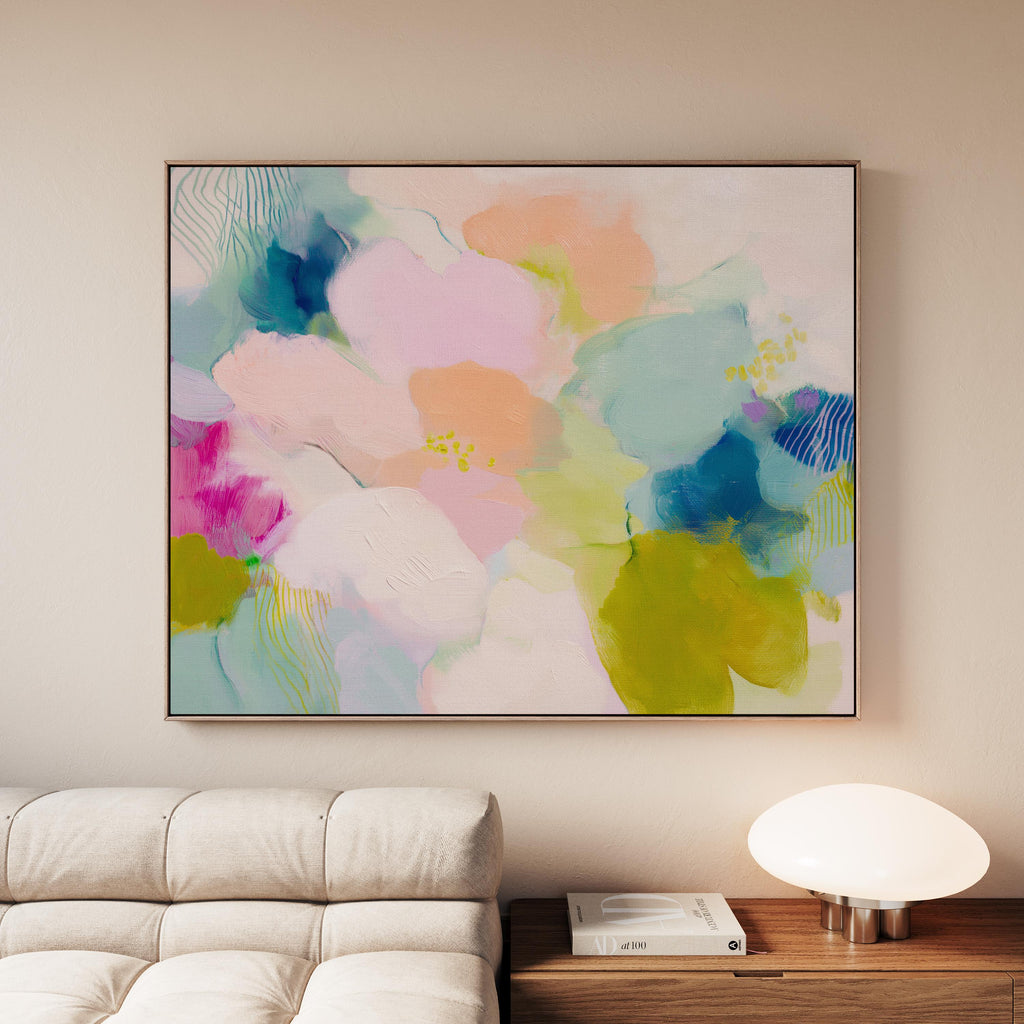 Muse Studio large framed abstract wall art on museum-grade artist canvas with fade-resistant giclée inks, framed in 100% solid wood with custom framing options in gold, silver, natural oak, black, and white, styled above a wood desk in a modern Soft Contemporary Pastel home office.