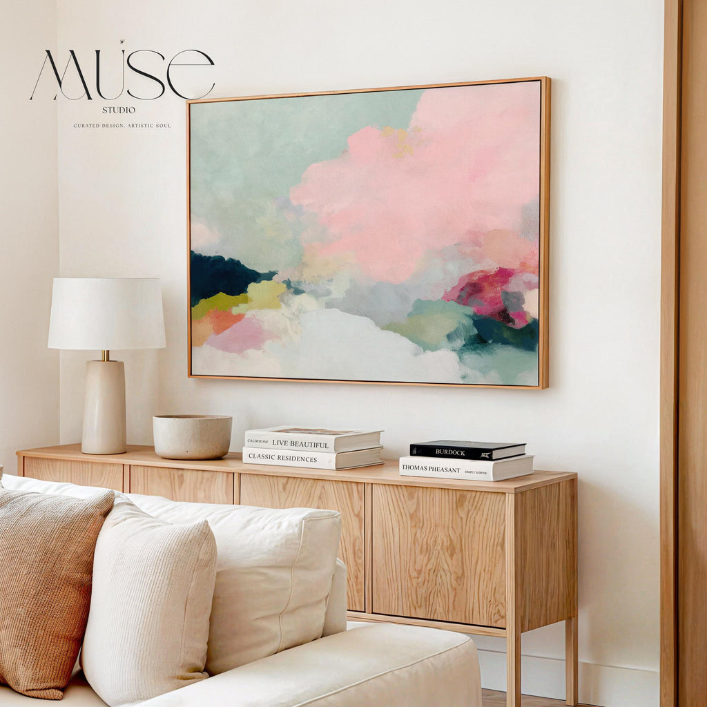 Spring Dawn No. 1059 by Muse Studio & Co. blush pink, mint green, navy, coral, and soft butter yellow abstract wall art printed with museum-grade giclée inks on premium gallery-wrapped artist canvas and custom framed in premium wood float frame options including natural, white, black, antique gold, and antique silver, styled above a neutral sofa in a calm designer living room.