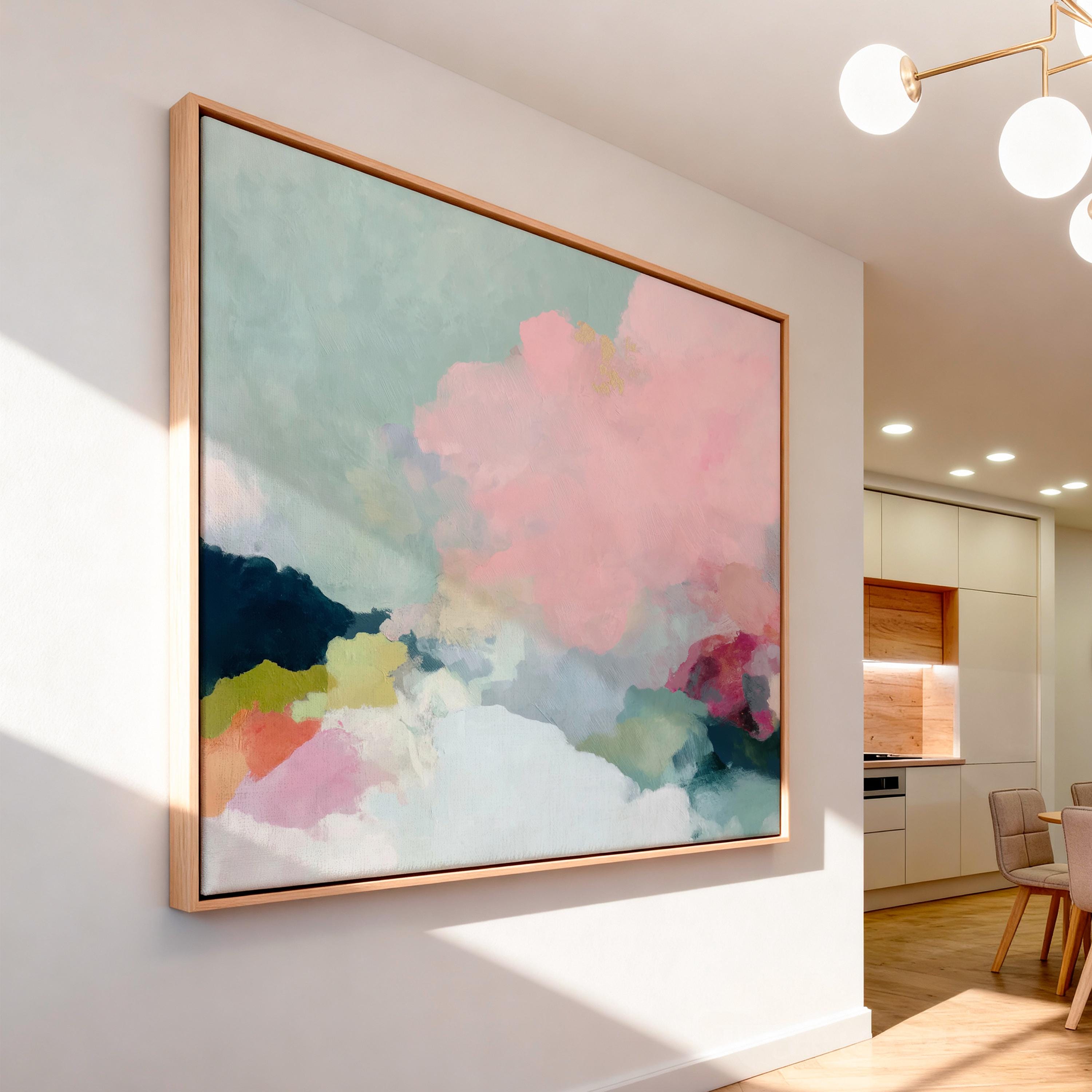 Spring Dawn No. 1059 by Muse Studio & Co. blush pink, mint green, navy, coral, and soft butter yellow abstract wall art printed with museum-grade giclée inks on premium gallery-wrapped artist canvas and custom framed in premium wood float frame options including natural, white, black, antique gold, and antique silver, styled above a neutral sofa in a calm designer living room.