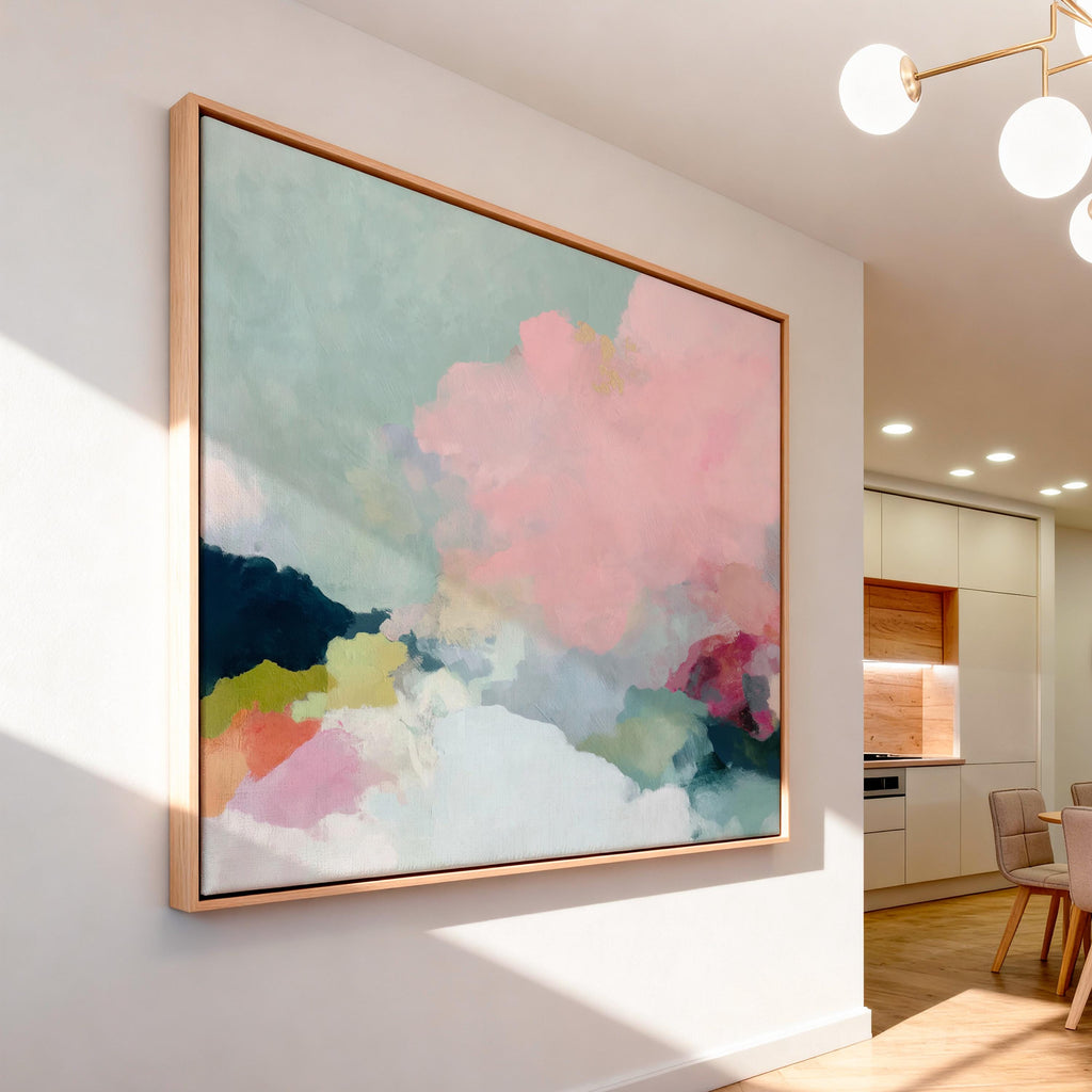 Spring Dawn No. 1059 by Muse Studio & Co. blush pink, mint green, navy, coral, and soft butter yellow abstract wall art printed with museum-grade giclée inks on premium gallery-wrapped artist canvas and custom framed in premium wood float frame options including natural, white, black, antique gold, and antique silver, styled above a neutral sofa in a calm designer living room.
