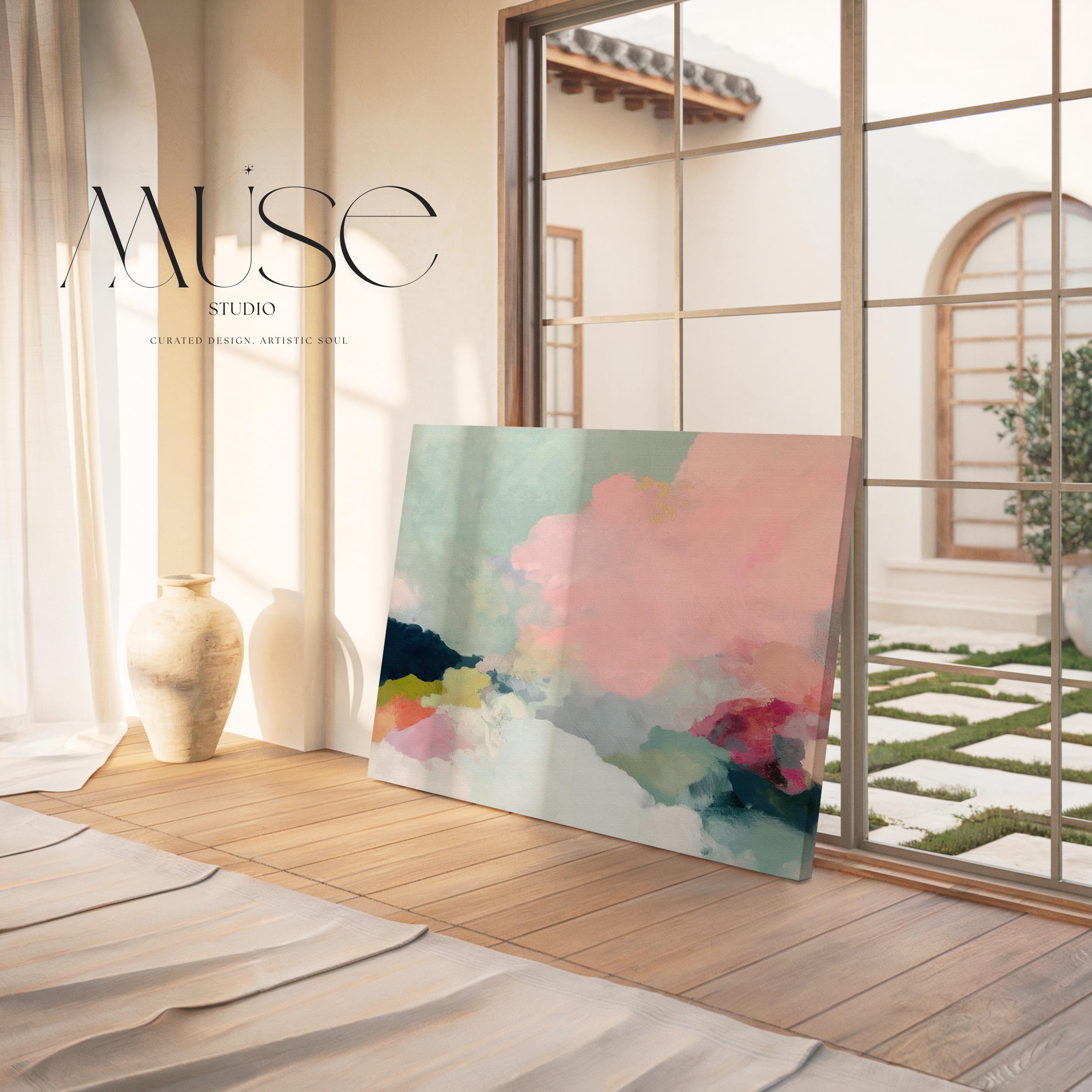 Spring Dawn No. 1059 by Muse Studio & Co. pink clouds abstract canvas wall art featuring blush pink, mint green, navy, coral, and soft butter yellow pastel colors printed with museum-grade giclée inks on premium gallery-wrapped artist canvas, styled above a neutral sofa in a calm designer living room interior.