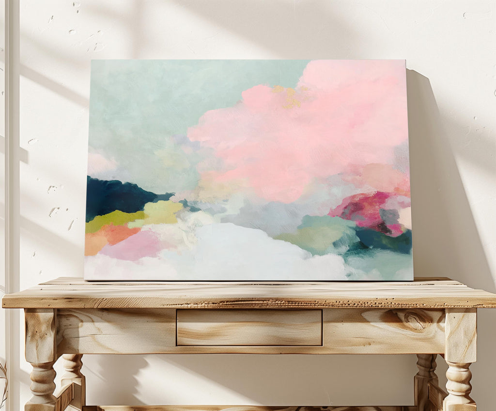 Spring Dawn No. 1059 by Muse Studio & Co. pink clouds abstract canvas wall art featuring blush pink, mint green, navy, coral, and soft butter yellow pastel colors printed with museum-grade giclée inks on premium gallery-wrapped artist canvas, styled above a neutral sofa in a calm designer living room interior.