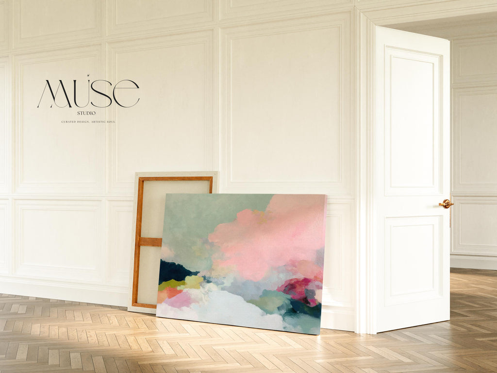 Spring Dawn No. 1059 by Muse Studio & Co. pink clouds abstract canvas wall art featuring blush pink, mint green, navy, coral, and soft butter yellow pastel colors printed with museum-grade giclée inks on premium gallery-wrapped artist canvas, styled above a neutral sofa in a calm designer living room interior.