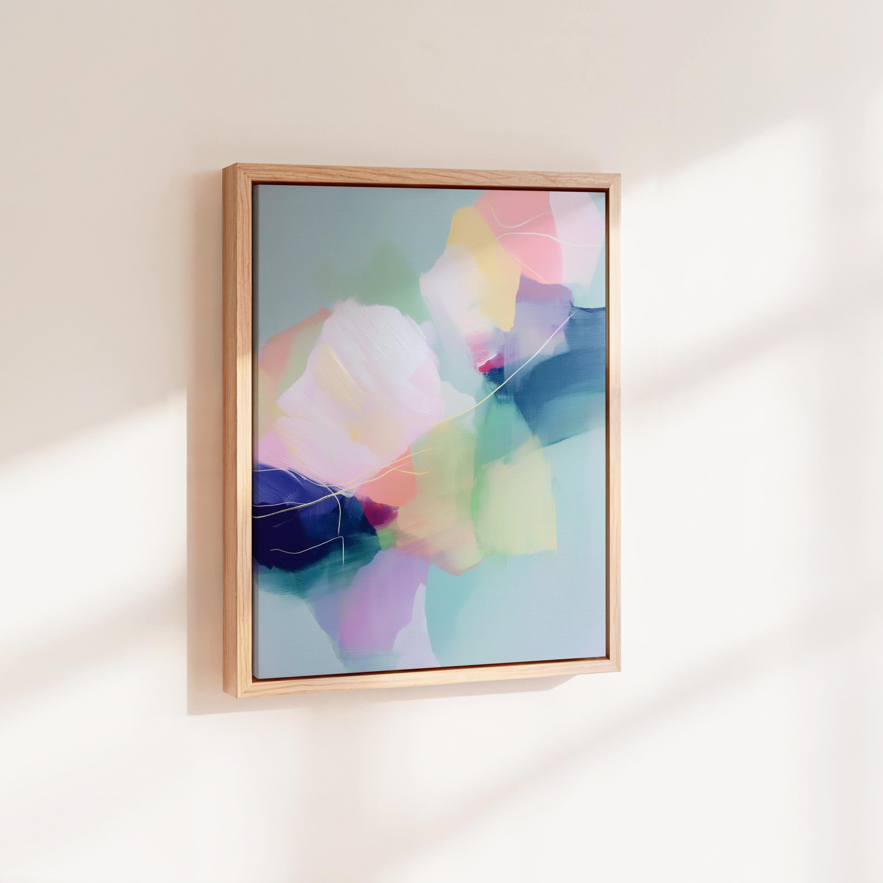 Petal Whisper 1050 by Muse Studio & Co., large vertical pastel floral abstract wall art in blush, yellow, mint and blue on premium cotton canvas with museum-grade giclée inks, framed in natural wood for Soft Atmospheric living rooms and Romantic Botanical spaces.