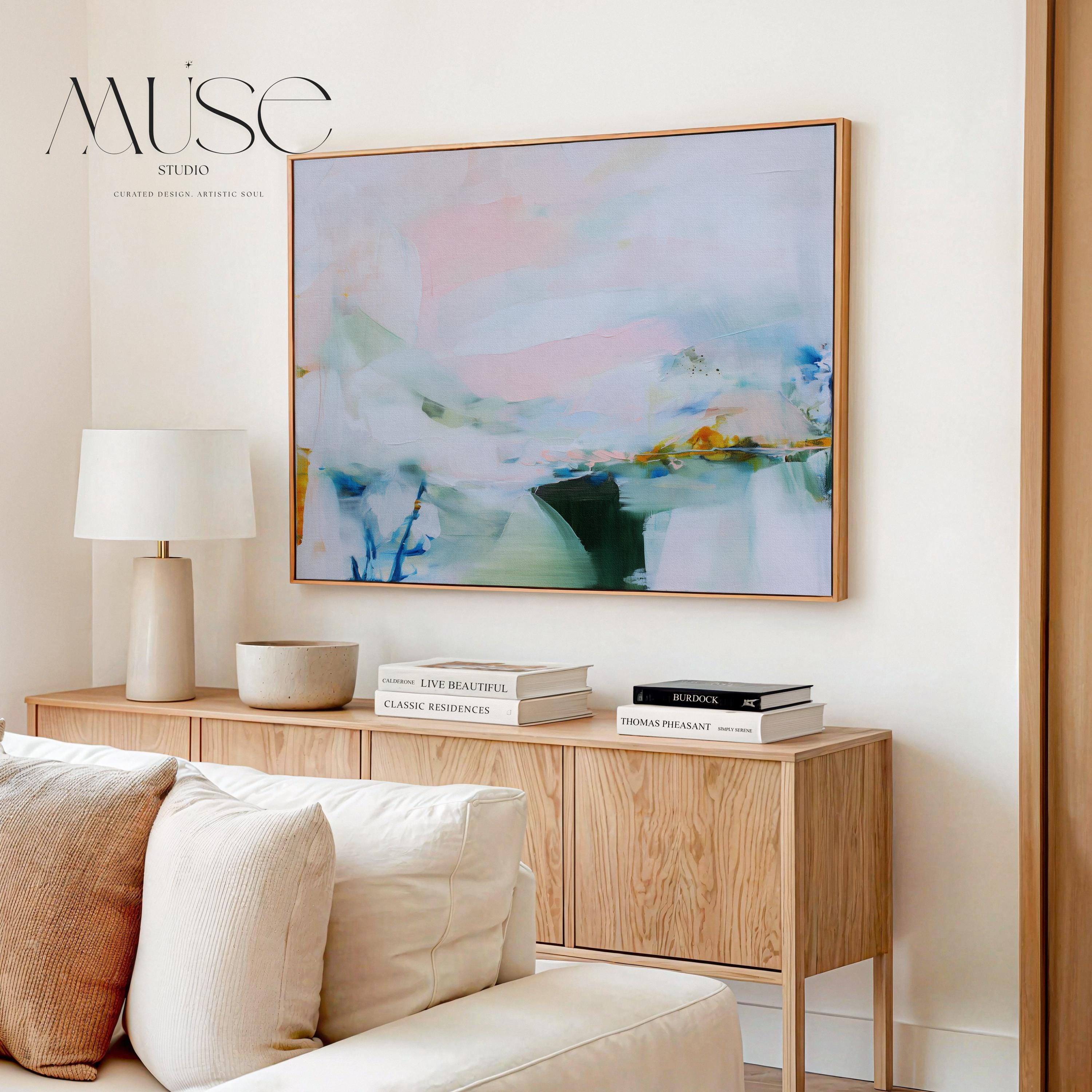 Framed abstract wall art by Muse Studio featuring lilac pink, blue, and soft green tones in a horizontal pastel composition, printed with museum-grade giclée inks on premium canvas, styled for living room or bedroom decor