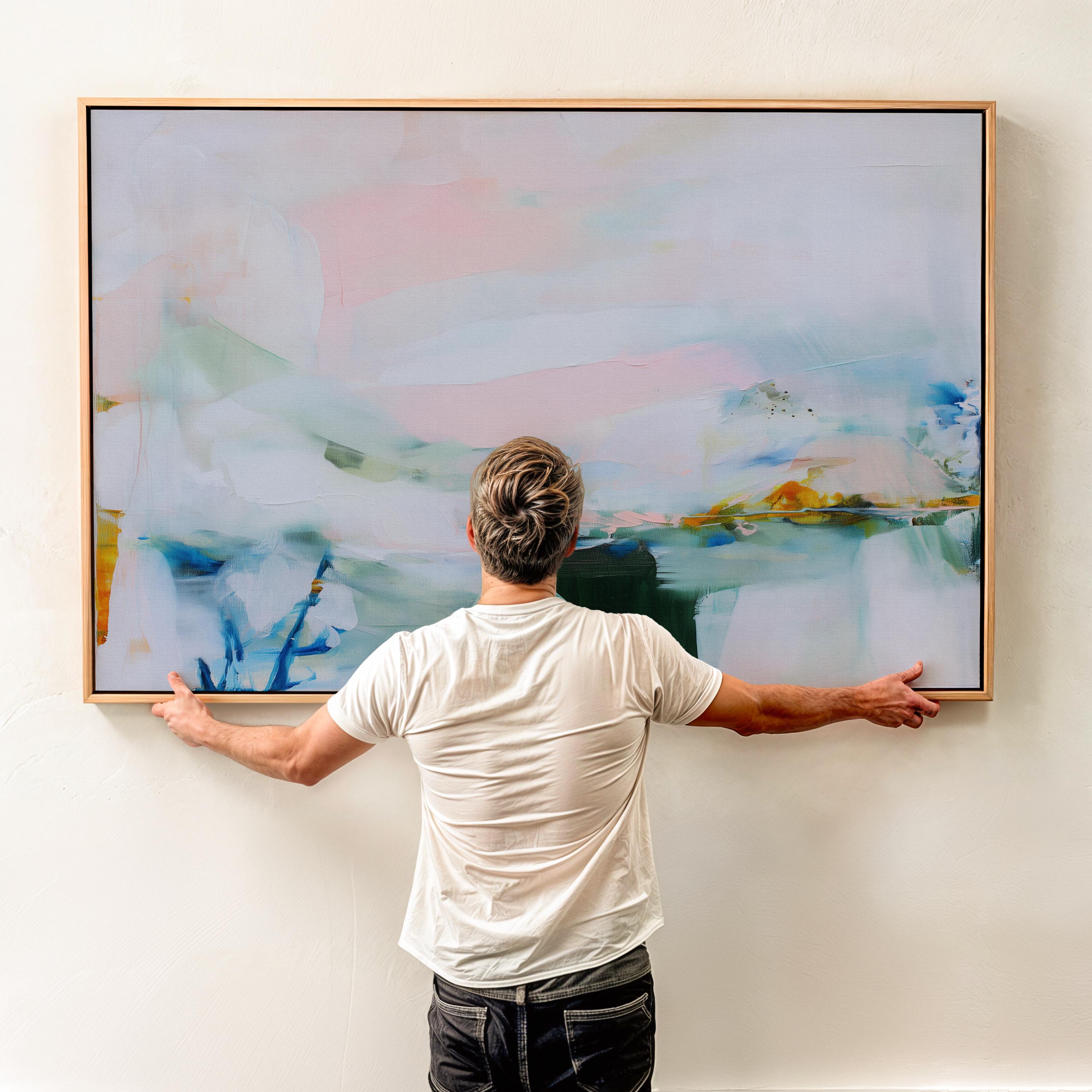 Framed abstract wall art by Muse Studio featuring lilac pink, blue, and soft green tones in a horizontal pastel composition, printed with museum-grade giclée inks on premium canvas, styled for living room or bedroom decor