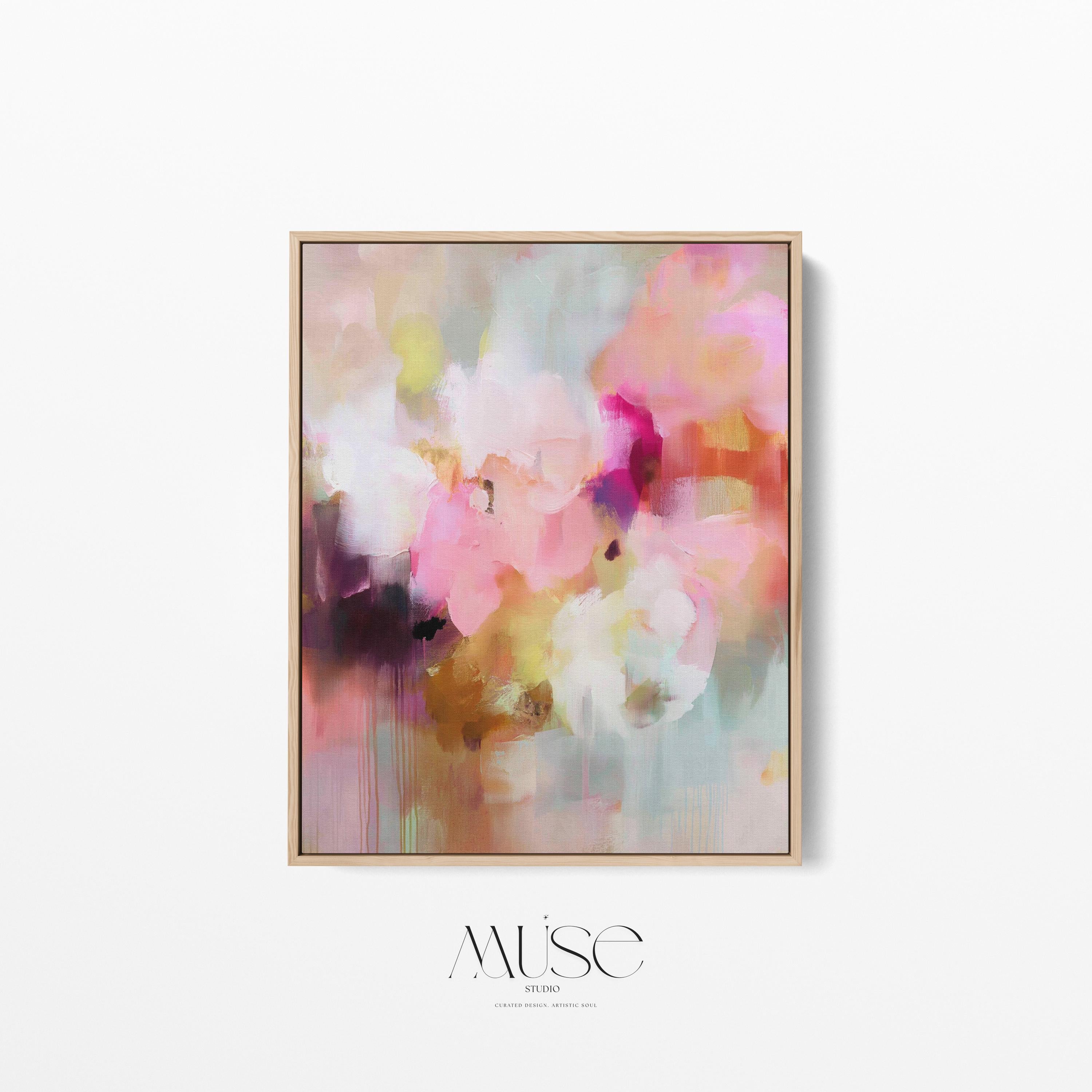 Spring Showers No. 1061 by Muse Studio & Co. vertical framed abstract wall art in blush pink, coral, ochre, and soft aqua tones, printed with museum-grade giclée inks on premium canvas and finished in a natural wood float frame, styled in a boho living room with warm neutral textures and layered decor.