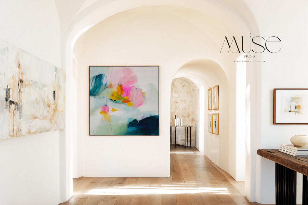 Poppy Fields No. 454 by Muse Studio & Co. vertical framed floral wall art in pink and red poppy tones, printed with museum-grade giclée inks on premium canvas and framed in a natural wood float frame, styled in a bright preppy living room.