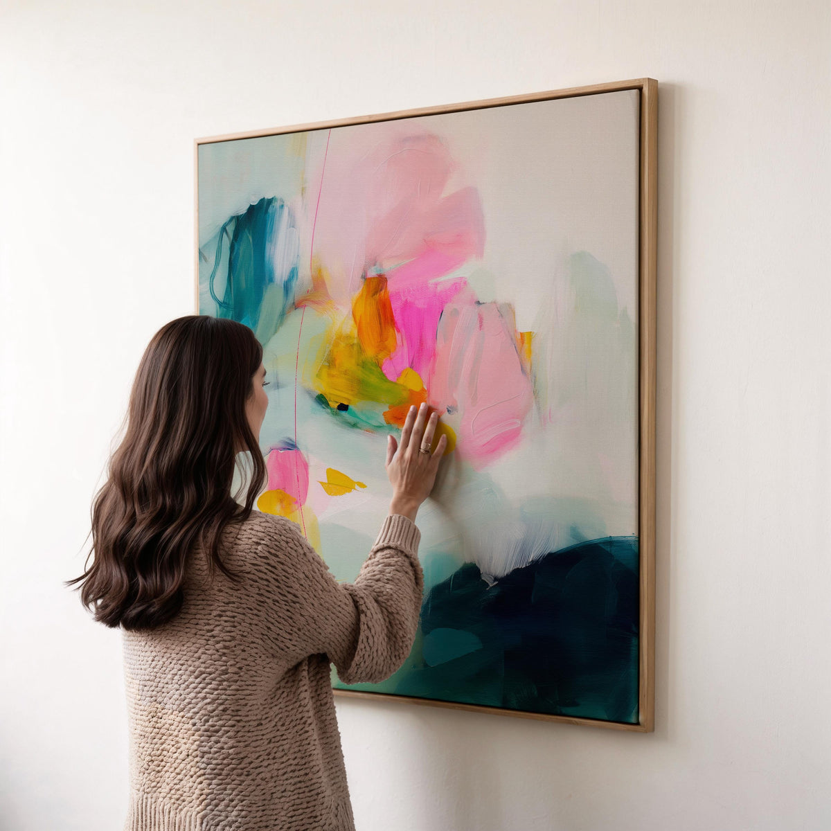 Poppy Fields No. 454 by Muse Studio & Co. vertical framed floral wall art in pink and red poppy tones, printed with museum-grade giclée inks on premium canvas and framed in a natural wood float frame, styled in a bright preppy living room.