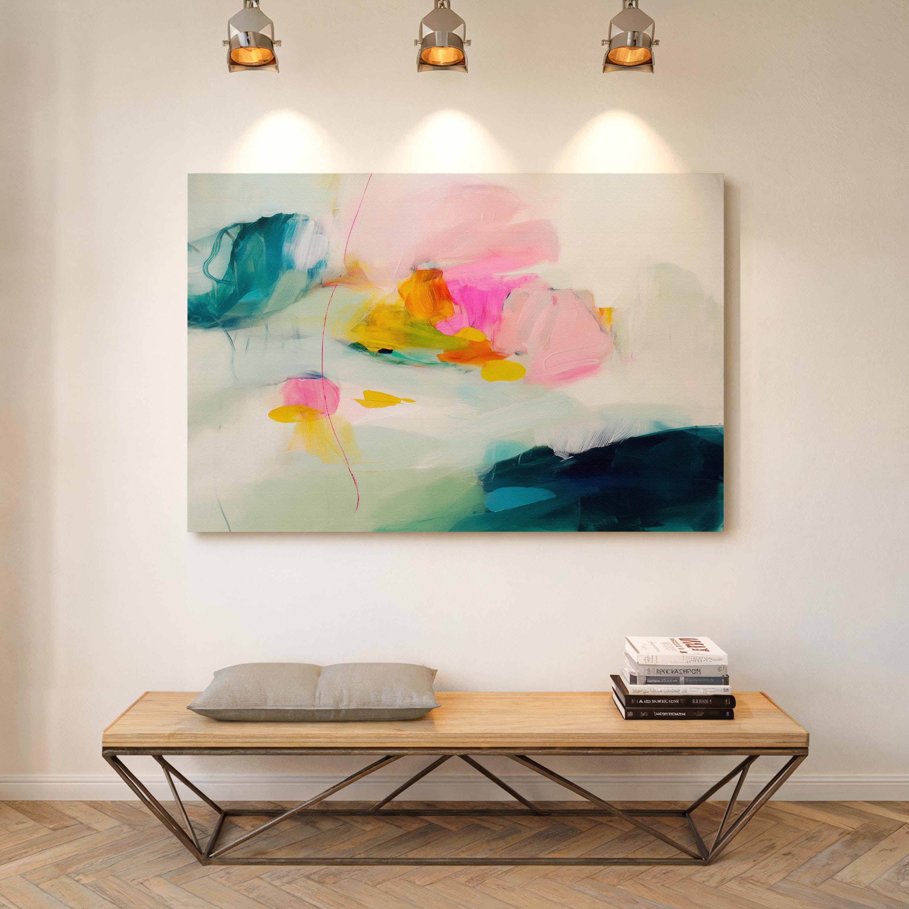 Poppy Fields No. 454 by Muse Studio & Co. colorful abstract wall art in pink, teal, yellow, and cream tones printed with museum-grade giclée inks on premium gallery-wrapped canvas, styled as large statement wall decor in a bright modern living room.