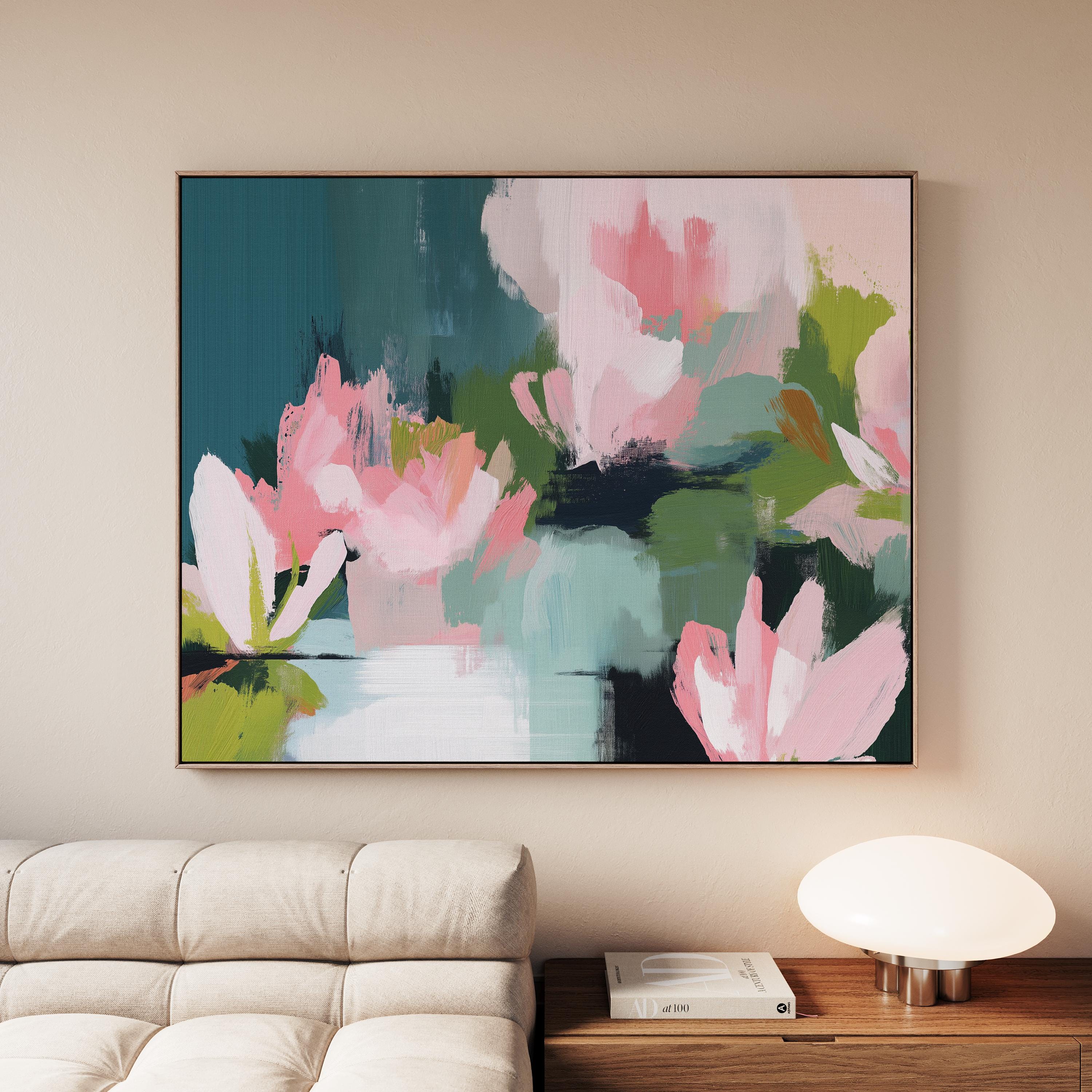 Magnolia Reverie No. 1037 by Muse Studio & Co. blush pink magnolia floral wall art with sage green and deep teal botanical brushwork printed with museum-grade giclée inks on premium gallery-wrapped cotton canvas and custom framed in natural wood with optional white, black, antique gold, or antique silver float frames to complement any decor style, styled in a coastal tropical beach home living room with airy interiors and light wood floors.