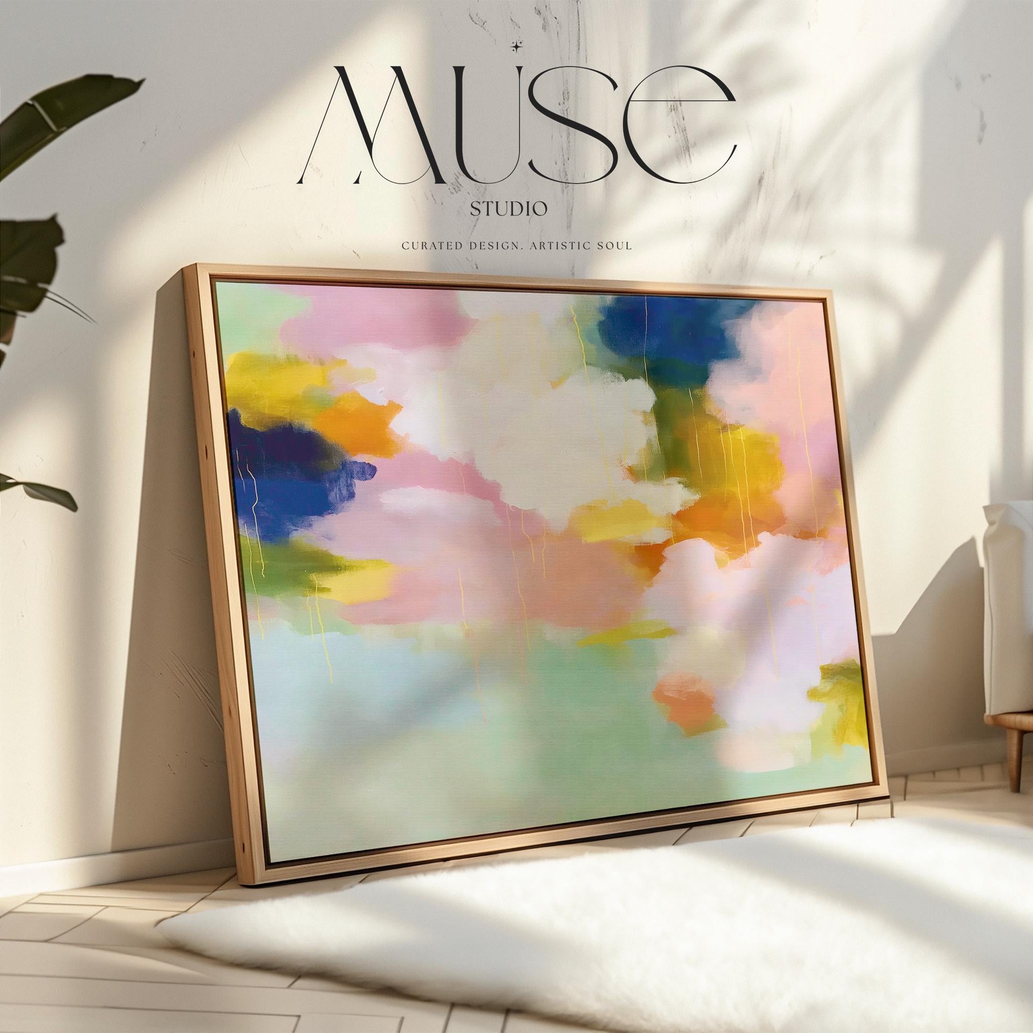 Blush Crescendo No. 291 by Muse Studio & Co. large horizontal pastel abstract framed canvas wall art in blush pink, teal and cream tones printed with museum-grade giclée inks on premium gallery-wrapped artist canvas with custom float frame options in natural, white, black, antique gold or antique silver, styled above a sofa in a soft contemporary living room.