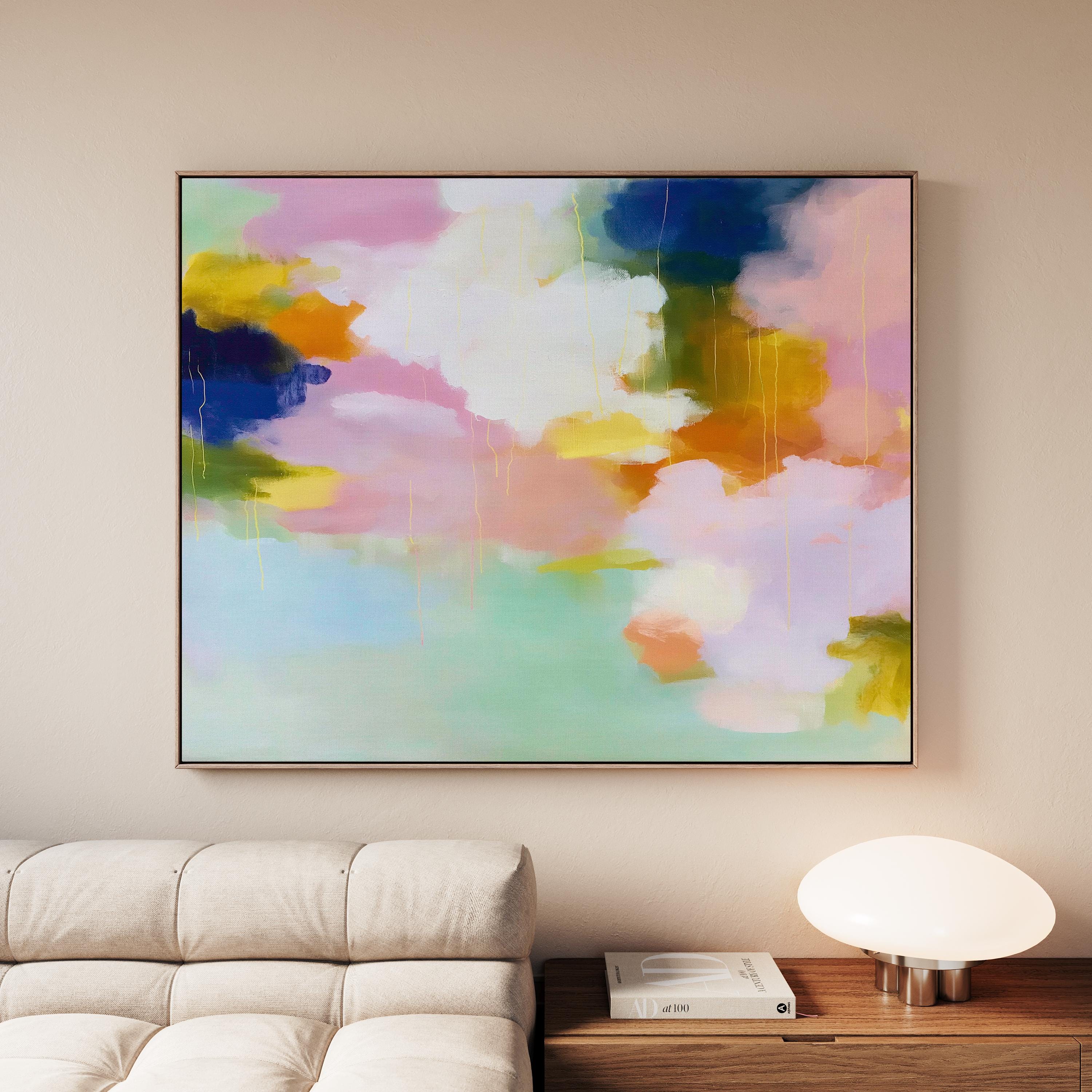 Blush Crescendo No. 291 by Muse Studio & Co. large horizontal pastel abstract framed canvas wall art in blush pink, teal and cream tones printed with museum-grade giclée inks on premium gallery-wrapped artist canvas with custom float frame options in natural, white, black, antique gold or antique silver, styled above a sofa in a soft contemporary living room.