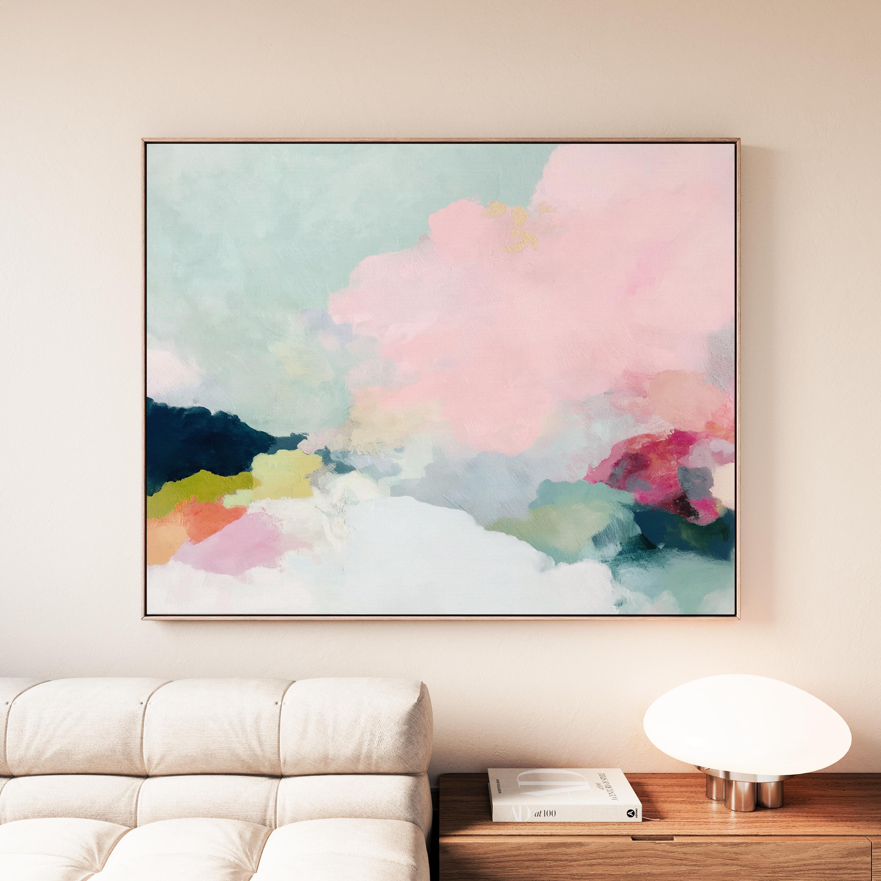 Spring Dawn No. 1059 by Muse Studio & Co. blush pink, mint green, navy, coral, and soft butter yellow abstract wall art printed with museum-grade giclée inks on premium gallery-wrapped artist canvas and custom framed in premium wood float frame options including natural, white, black, antique gold, and antique silver, styled above a neutral sofa in a calm designer living room.