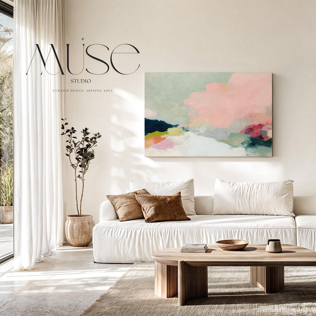 Spring Dawn No. 1059 by Muse Studio & Co. pink clouds abstract canvas wall art featuring blush pink, mint green, navy, coral, and soft butter yellow pastel colors printed with museum-grade giclée inks on premium gallery-wrapped artist canvas, styled above a neutral sofa in a calm designer living room interior.