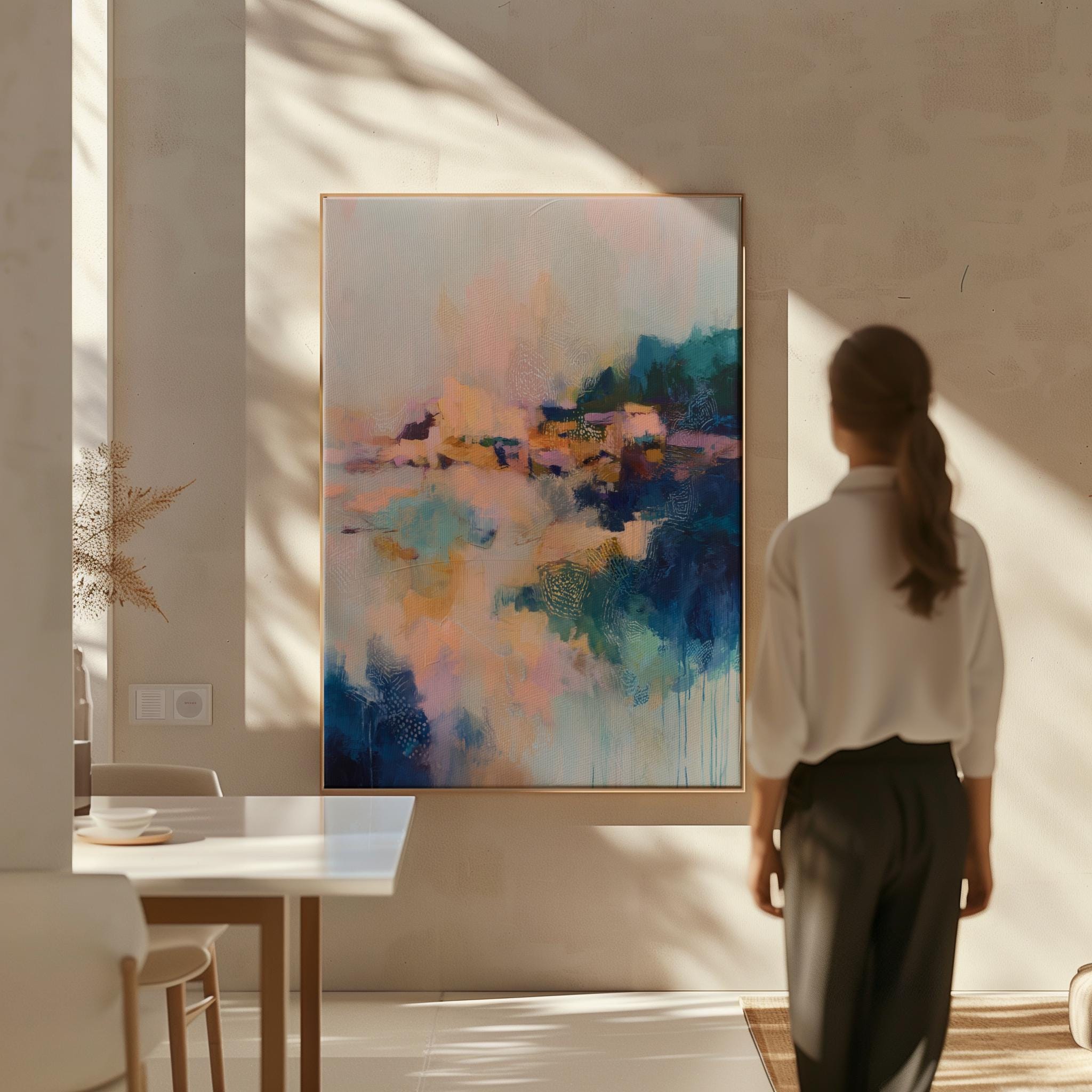 Vertical framed abstract wall art in blush, peach, teal, and navy with soft painterly textures and subtle gold undertones. Ideal for bedrooms, transitional entryways, or softly styled interiors. Available as a floating framed canvas for curated, color-forward decor.