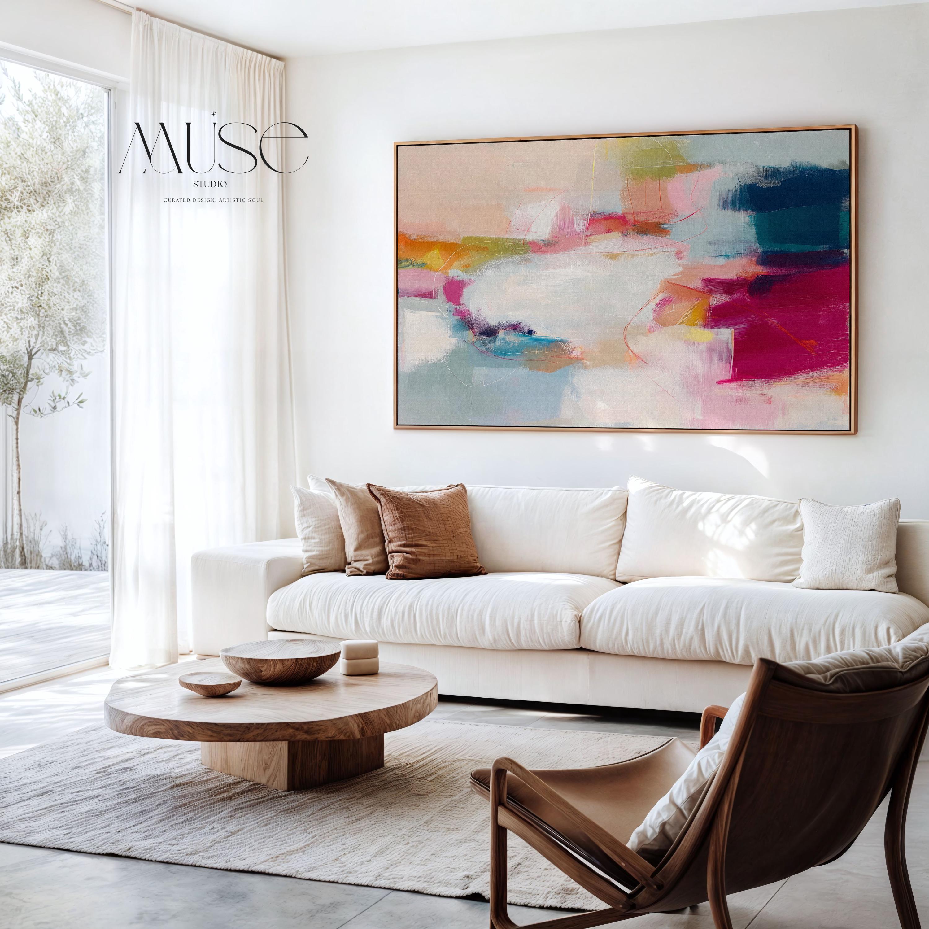 Horizontal framed abstract wall art featuring pink, blue, and golden hues in a softly blended composition. Ideal for Soft Contemporary interiors, this elegant piece brings warmth and sophistication to living rooms, offices, or designer-curated spaces. Floater framed in FSC-certified wood and printed on archival cotton-blend canvas for a premium gallery-quality finish.