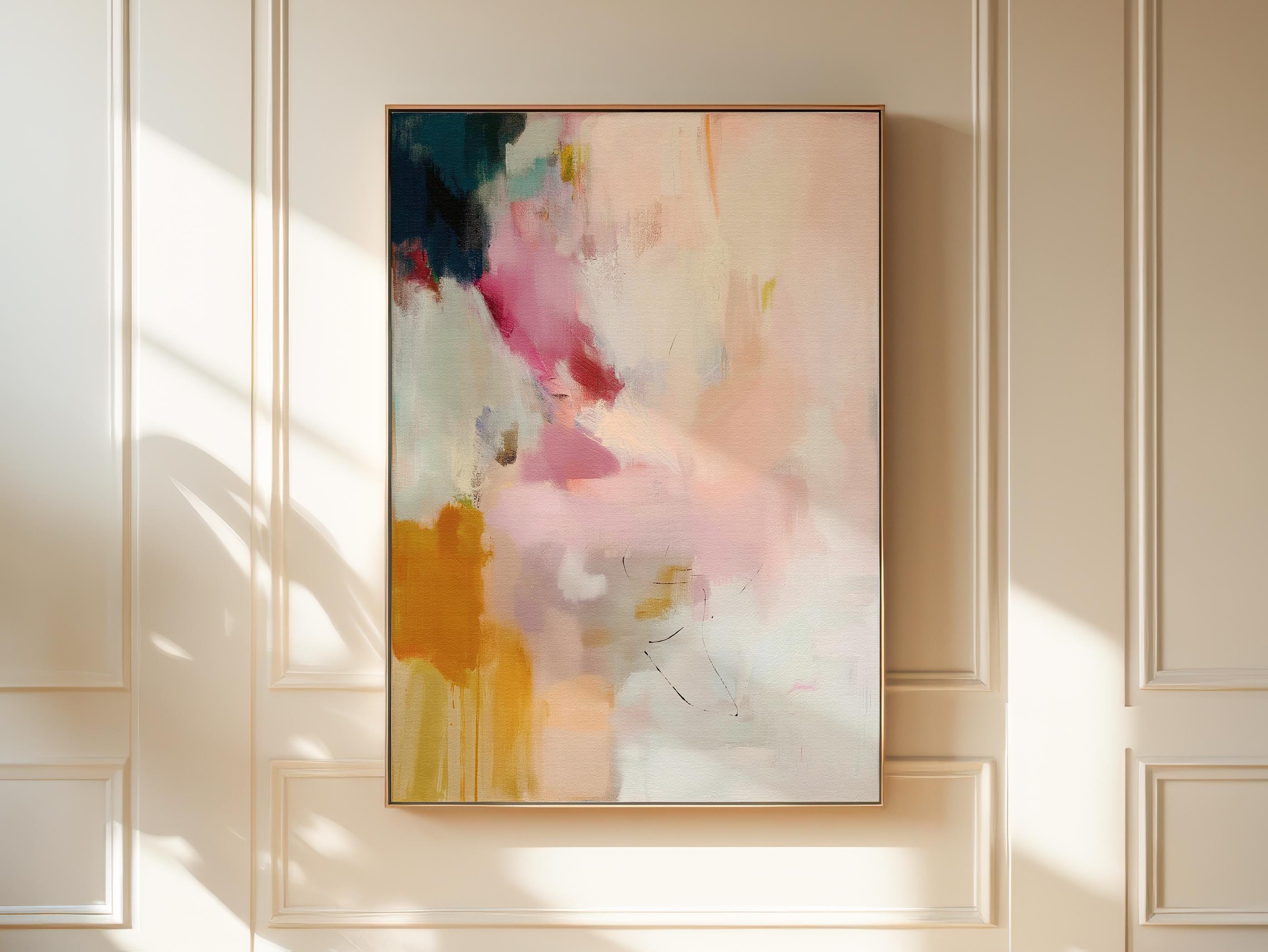 Desert Veil No. 1019 by Muse Studio & Co. vertical abstract wall art in blush coral ochre neutral tones printed with museum-grade giclée inks on premium canvas and framed in a natural wood float frame, styled in a warm modern living room.