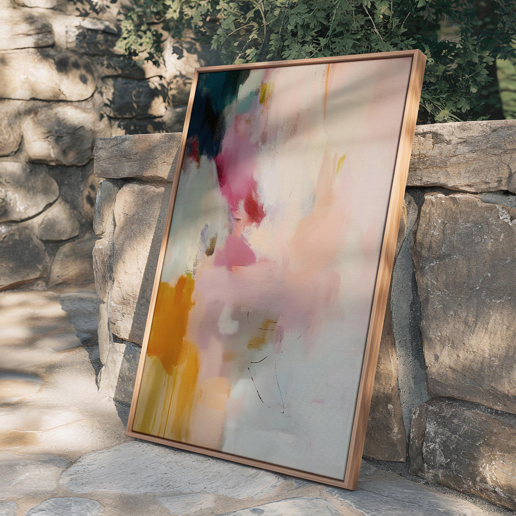 Desert Veil No. 1019 by Muse Studio & Co. vertical abstract wall art in blush coral ochre neutral tones printed with museum-grade giclée inks on premium canvas and framed in a natural wood float frame, styled in a warm modern living room.