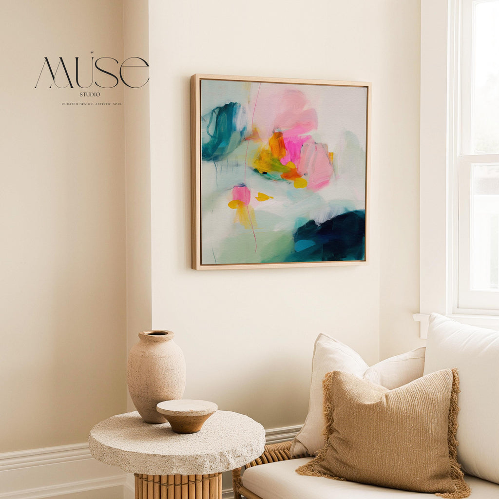 Poppy Fields No. 454 by Muse Studio & Co. vertical framed floral wall art in pink and red poppy tones, printed with museum-grade giclée inks on premium canvas and framed in a natural wood float frame, styled in a bright preppy living room.