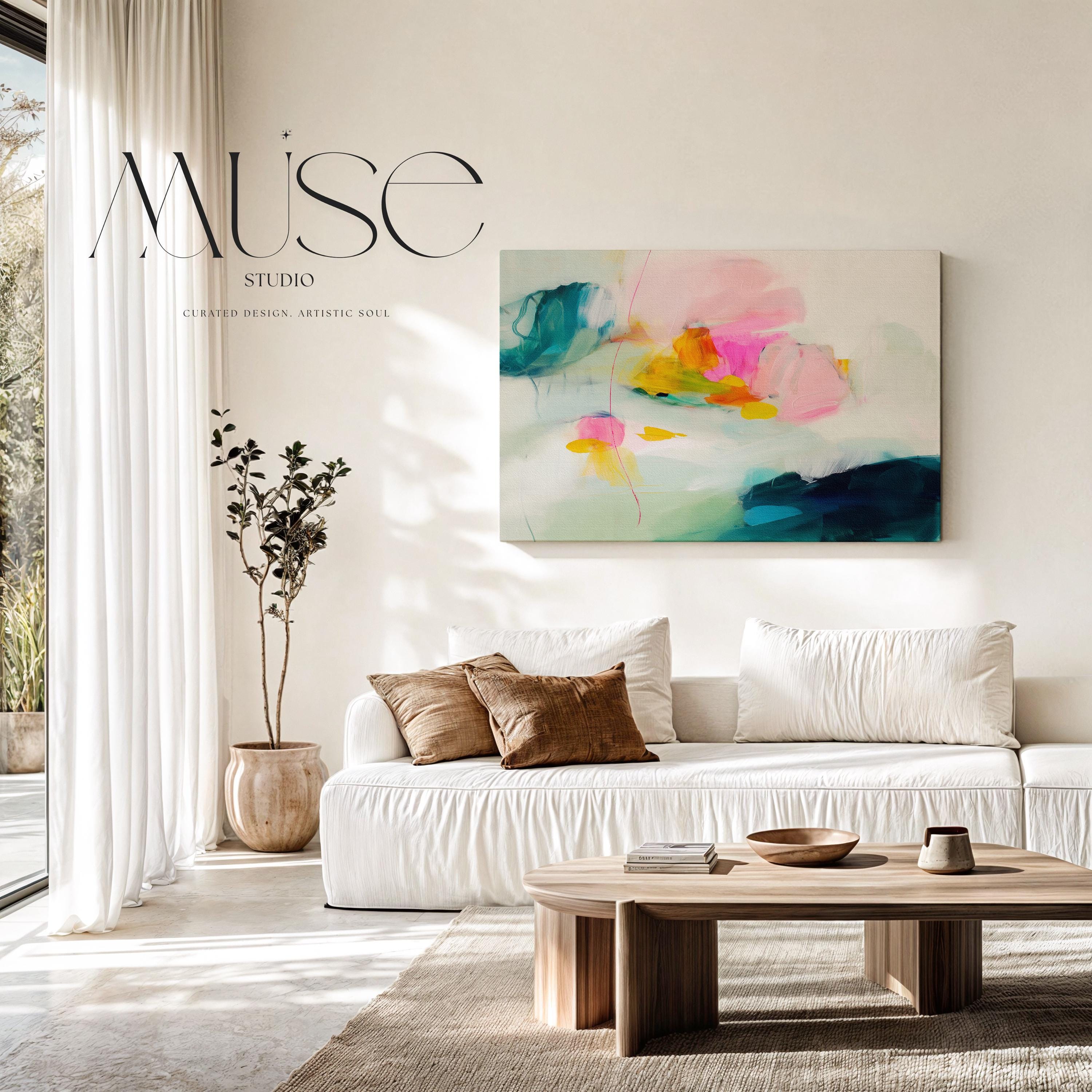 Poppy Fields No. 454 by Muse Studio & Co. colorful abstract wall art in pink, teal, yellow, and cream tones printed with museum-grade giclée inks on premium gallery-wrapped canvas, styled as large statement wall decor in a bright modern living room.