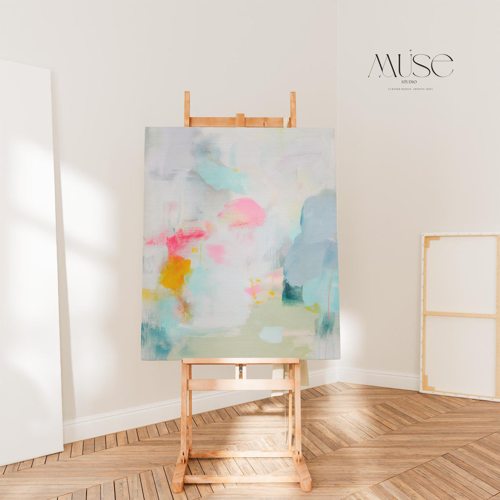 Misty Garden No. 1063 by Muse Studio & Co. pastel abstract canvas wall art in blush pink, teal, soft yellow and neutral tones, printed with museum-grade giclée inks on premium gallery-wrapped canvas, styled above a bed in a serene contemporary bedroom