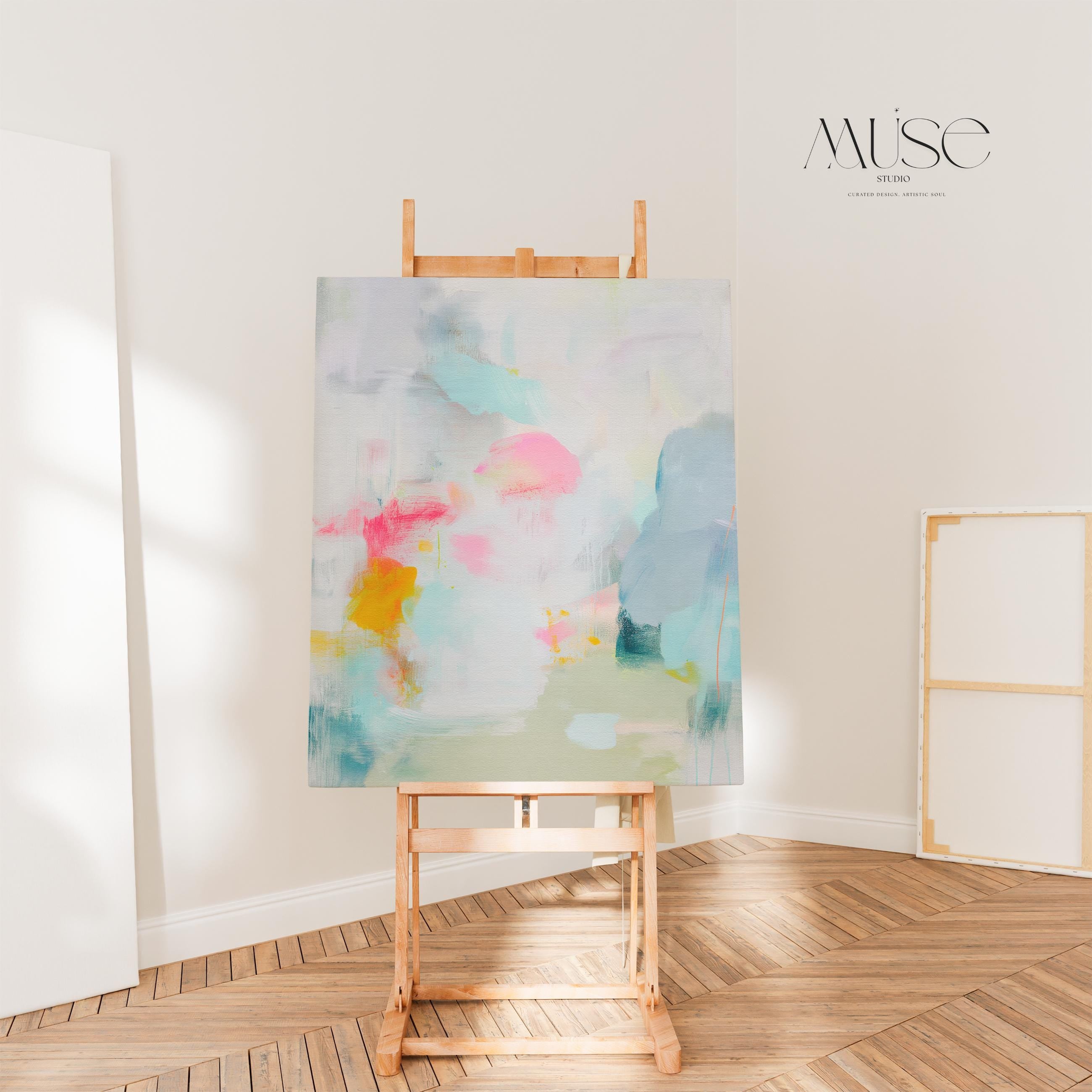 Misty Garden No. 1063 by Muse Studio & Co. pastel abstract canvas wall art in blush pink, teal, soft yellow and neutral tones, printed with museum-grade giclée inks on premium gallery-wrapped canvas, styled above a bed in a serene contemporary bedroom