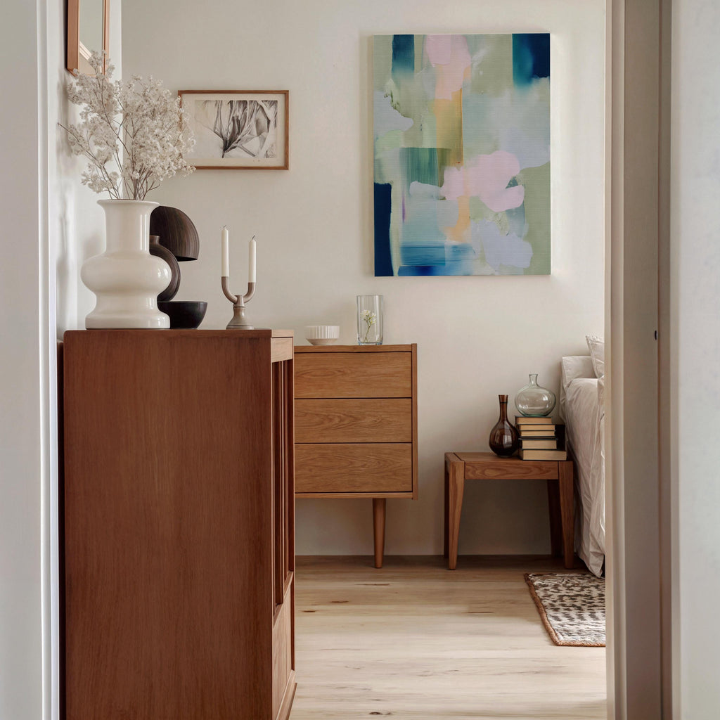 Muse Studio vertical pastel botanical canvas wall art in a blush blue sage palette, available as stretched canvas and rolled canvas, featuring soft pink, misty blue, pale sage, ivory, and deep navy abstract organic forms, printed with museum-grade giclée inks on premium artist canvas for bedroom decor, spa decor, and serene soft contemporary interiors.