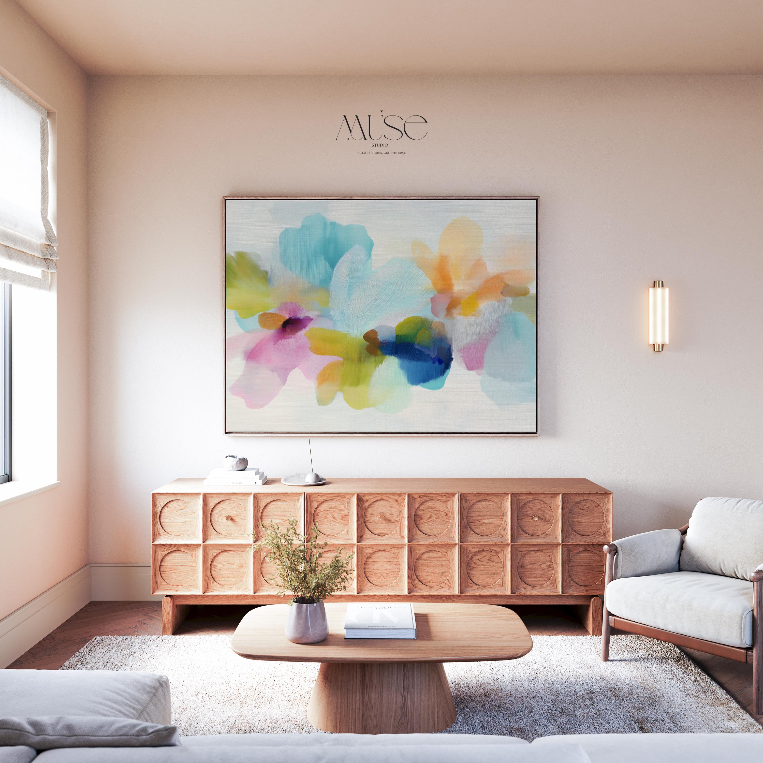 Muse Studio framed canvas wall art in pastel aqua, blush pink, peach, yellow, green, and cobalt blue floral abstract style, printed with museum-grade giclée inks on premium artist-grade canvas, available as a horizontal framed canvas, styled in a serene bedroom, living room, or soft contemporary office.