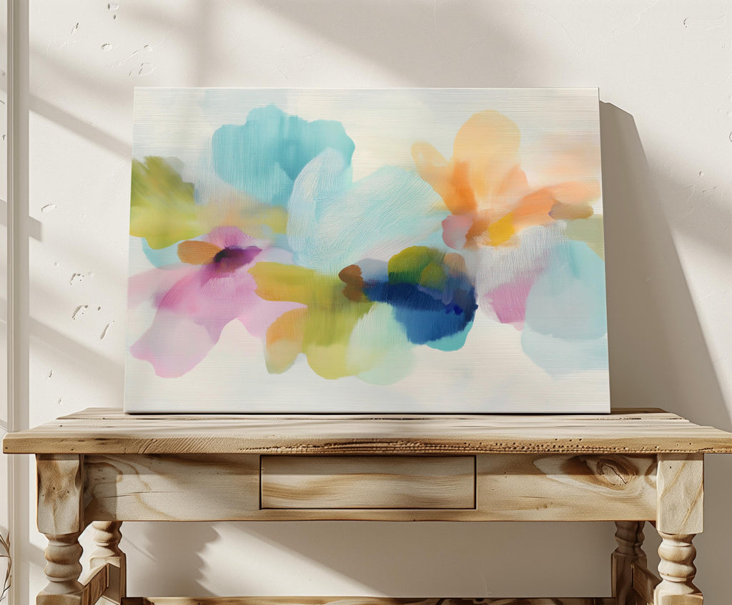 Muse Studio canvas wall art in pastel aqua, blush pink, peach, yellow, green, and cobalt blue floral abstract style, printed with museum-grade giclée inks on premium artist-grade canvas, available as horizontal stretched or rolled canvas, styled in a serene bedroom, living room, or soft contemporary office.