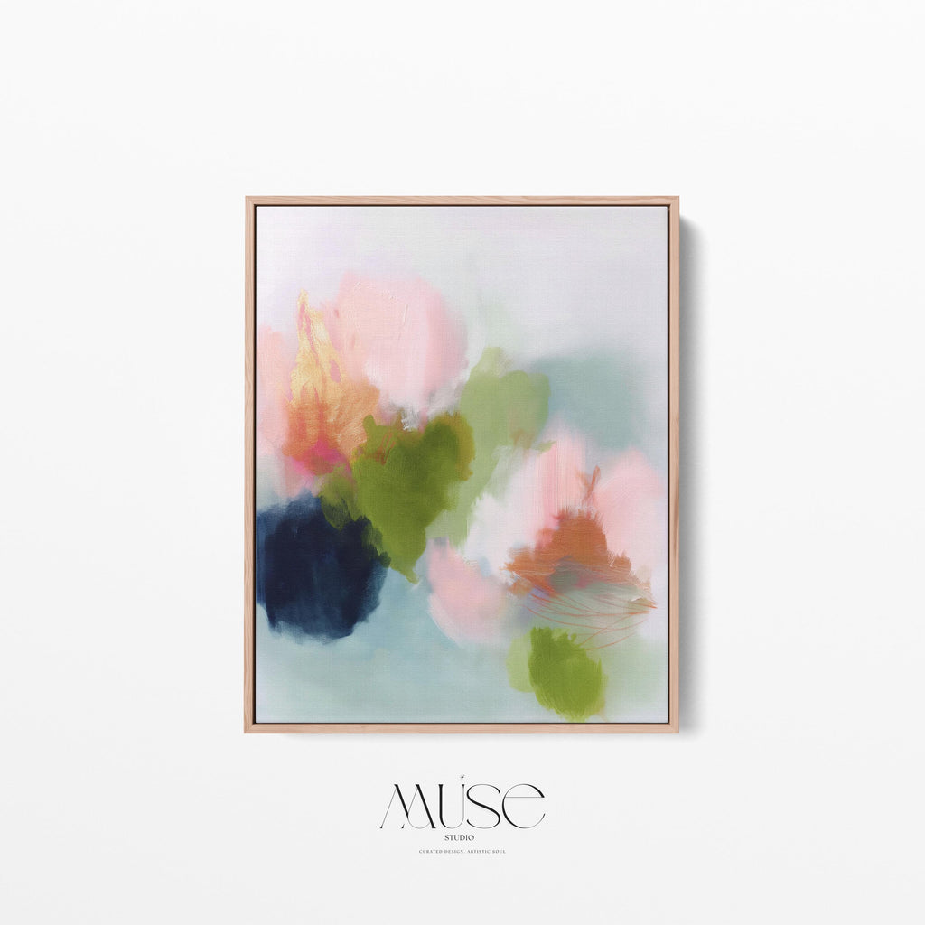 Muse Studio framed wall art in blush pink, olive green, soft aqua, and peach floral abstract tones, printed with museum-grade giclée inks on premium artist canvas and available in custom natural, white, black, antique gold, or antique silver float frames, styled as vertical statement artwork for a bedroom, office, or living room.