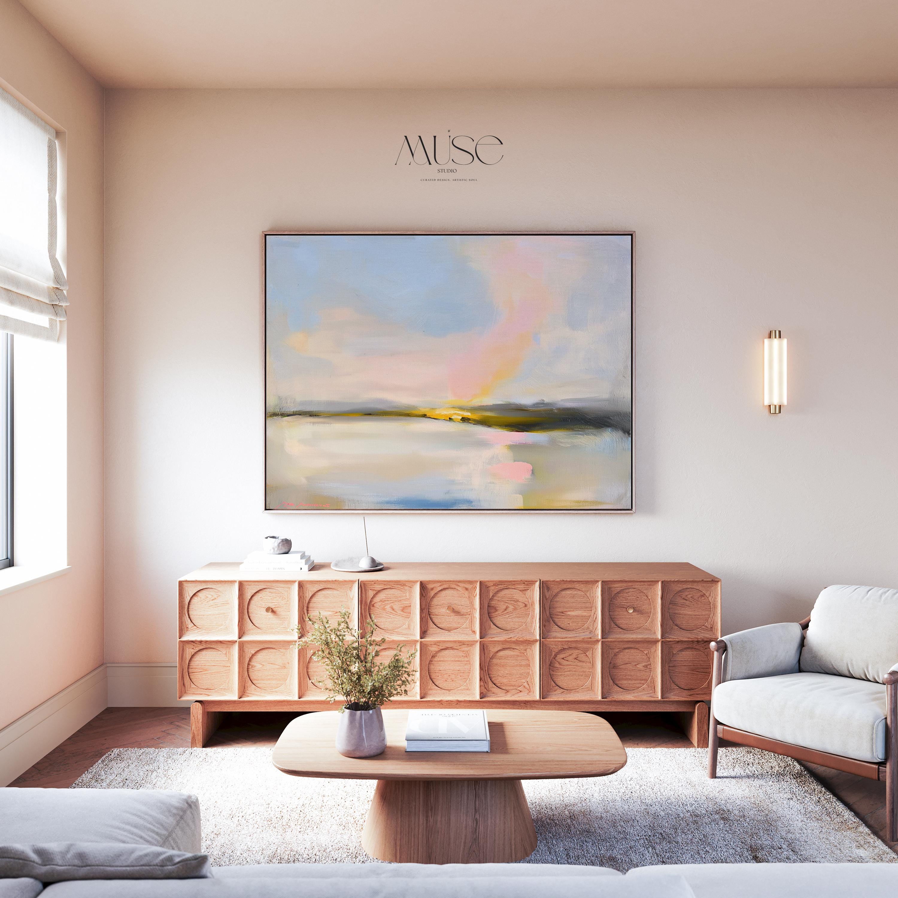 Muse Studio framed abstract landscape wall art with pastel pink, blue, cream, gray, and golden neutral tones. Large square framed canvas artwork with soft coastal horizon movement, museum-grade giclée inks, premium cotton canvas, and custom wood float frame options, styled for living room, bedroom, office, dining room, or elevated modern coastal decor.