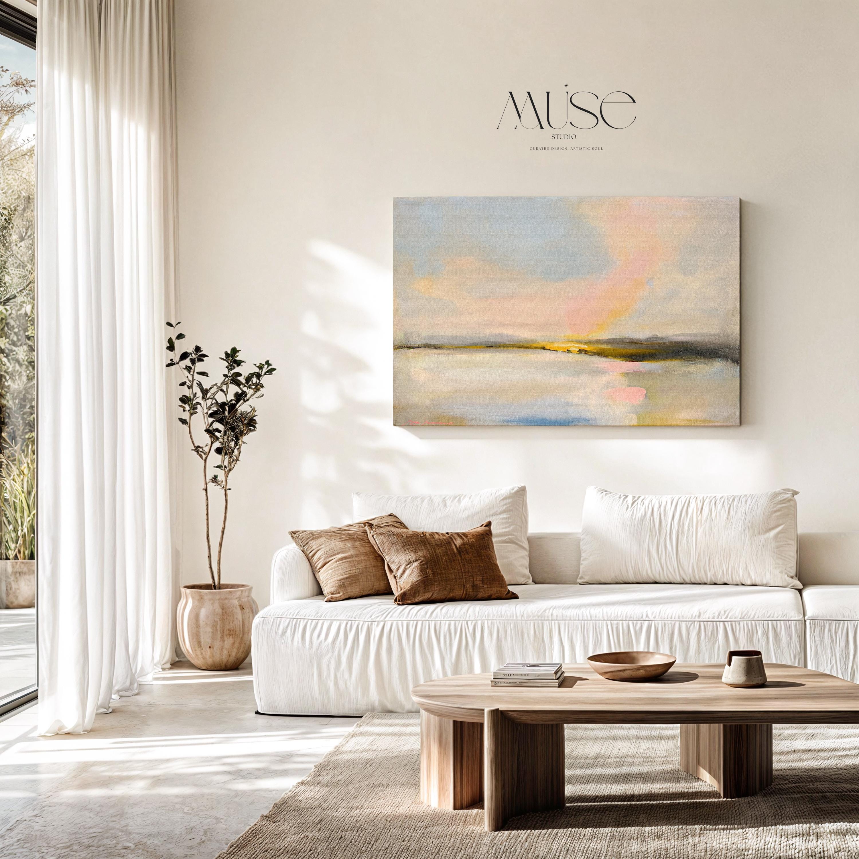 Muse Studio pastel coastal canvas wall art featuring a soft pink and blue abstract landscape with cream, gray, blush, and golden neutral tones. Large square canvas artwork with painterly horizon movement, museum-grade giclée inks, and premium gallery-wrapped cotton canvas, styled above a console for living room, bedroom, office, dining room, or modern coastal interiors.